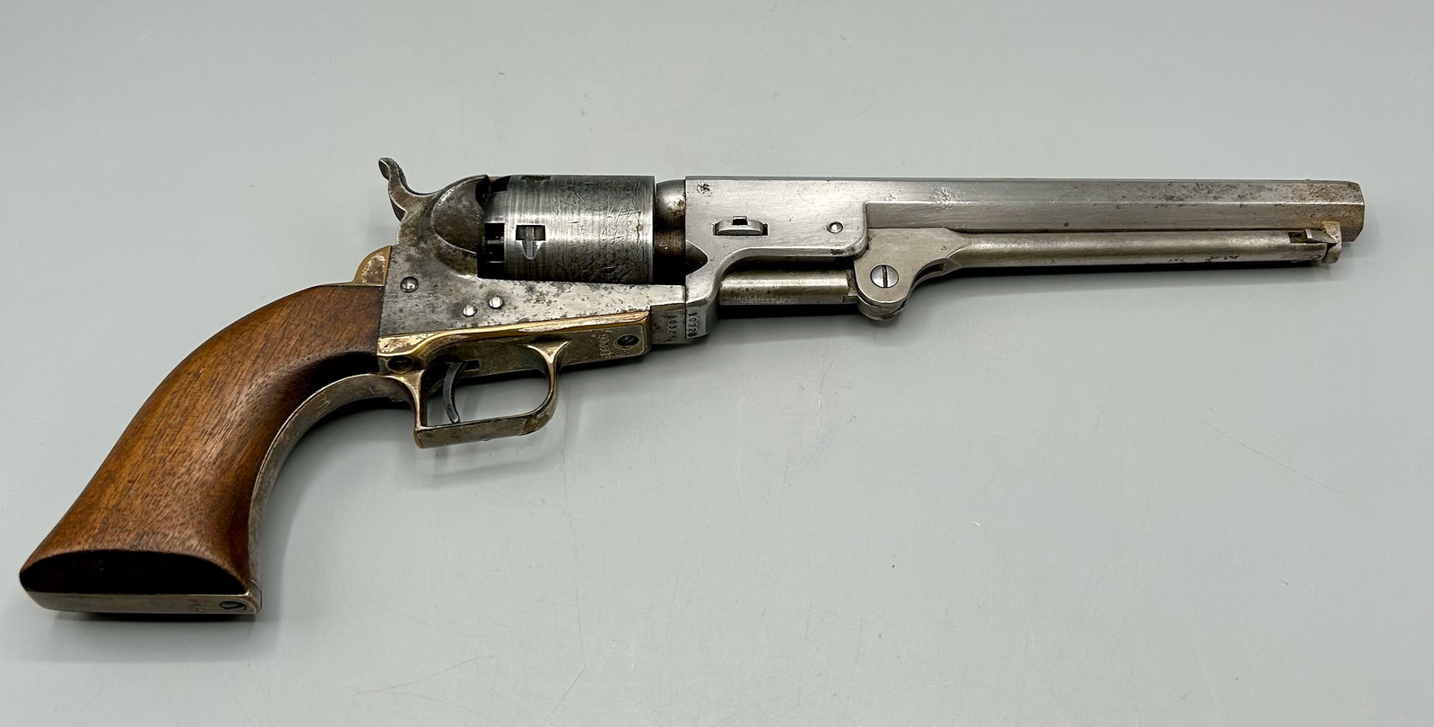 An Antique 1851 Colt Navy Pistol: A 13 inch 1851 Colt Percussion Navy Pistol, a 36 caliber black powder pistol. Top of the 7 1/2 inch barrel reads " Address SamL Colt New York City," "Colts Patent" is on one side of the frame, the cyl
