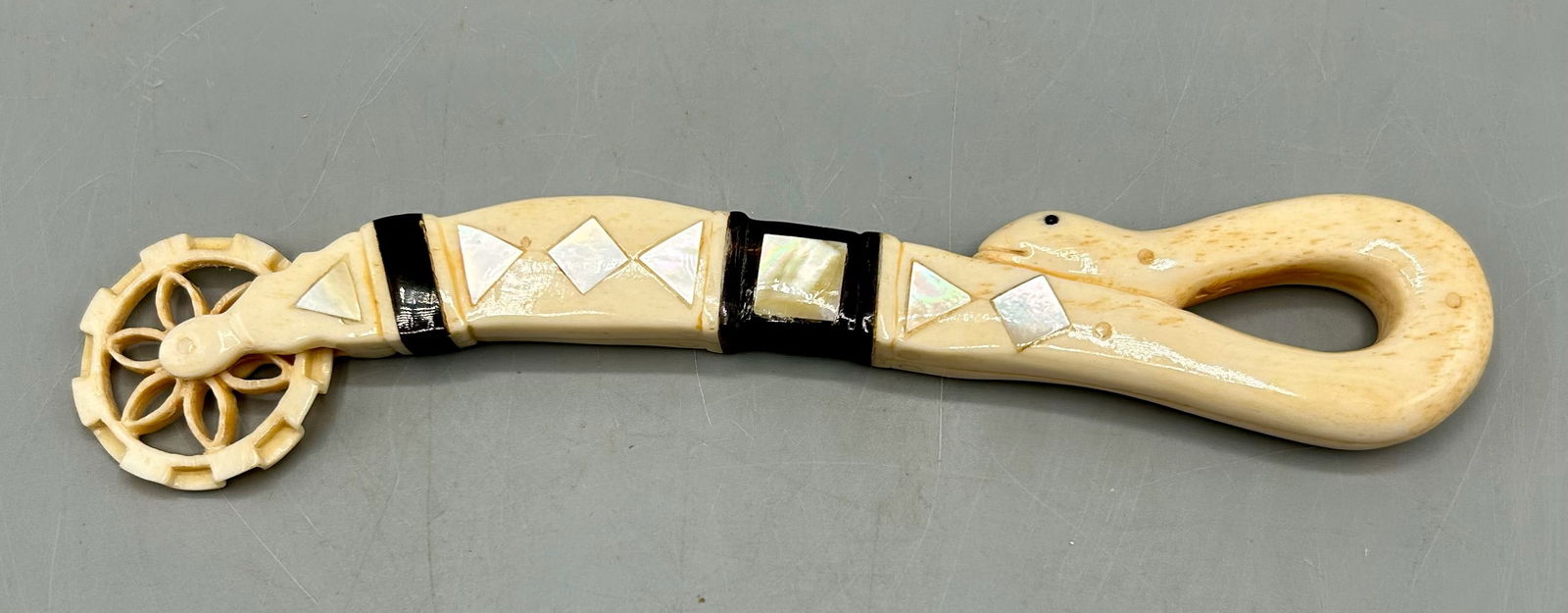 Antique Pie Crimper or Jagging Wheel: This item / lot is availible only to Massachusetts Residents. A 7 inch Sea serpent motif jagging wheel / pie crimper traditionally made by sailors for loved ones back home. Often referred to as Scrims