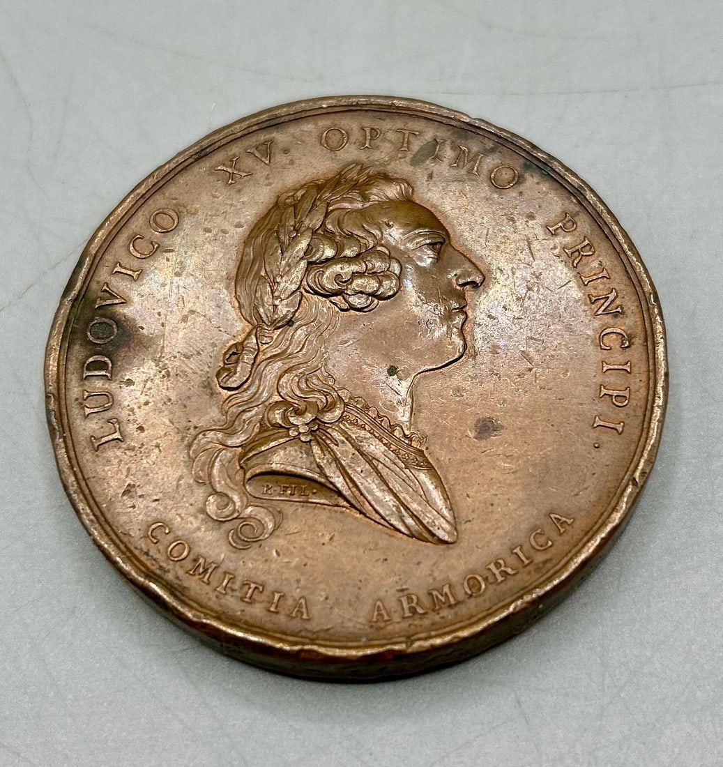 1758 Ludovico XV Medal: A 2 7/16 inch copper medal by artist R. Filius. minted in France. Image of King Louis XV of France, reverse side displays Brittany and Mars on either side of a breadfruit tree. The medal is thought to