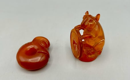 A Carved Stone Mask and a Carved Amber Rat