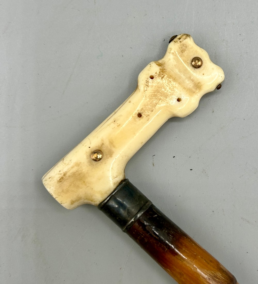 Carved Bone and Wooden Riding Crop or Swagger Stick: A 19 1/2 inch long carved Bone and Wooden Riding Crop or swagger stick -as found, minor age cracks in the bone.