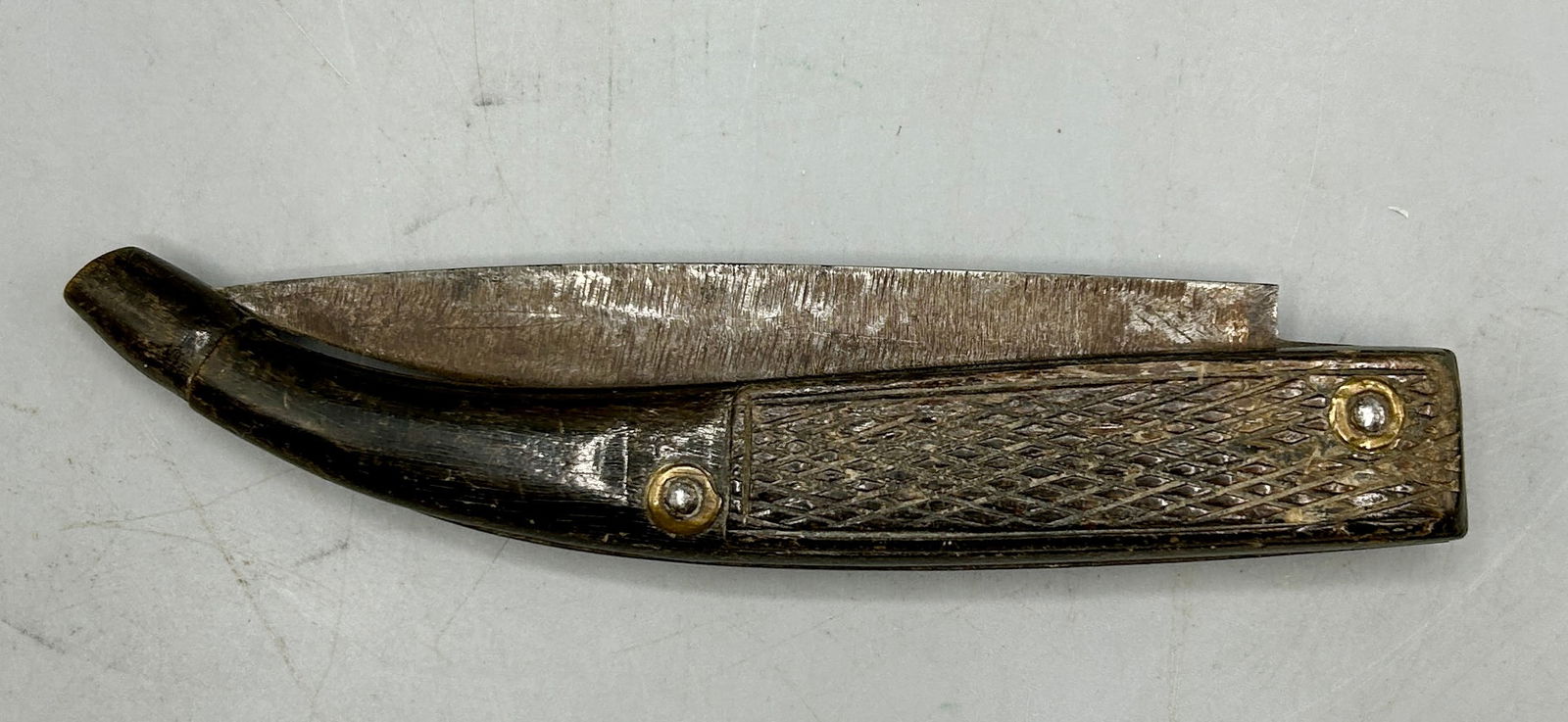 Folding Knife with a Cross Hatched Handle (1 of 4)