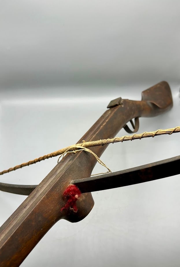 An Antique Crossbow: A 27 1/2 by 27 1/2 inch antique crossbow made for "A.F. Stoeber JNV., New York City," after 1870 items made in Germany were stamped "Germany" and this stamp is below the NYC address. Due to its age we