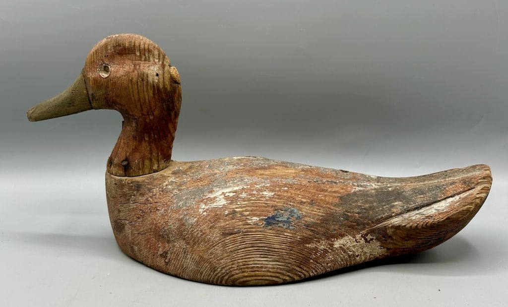 Primitive Pintail Hen Decoy from Lousiana: A 12 inch folk art Pintail hen decoy from Louisiana with a carved "M" and "FR" in the bottom. As found.