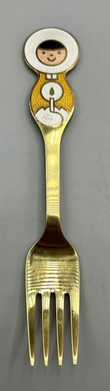 Danish Gilded Sterling Silver and Enamal Fork: A 6 inch gilded silver fork with enamel child with candle by the Anton Michelsen Co, (1841-1985), Copenhagen, Denmark. In 1985 the Company was acquired by the Georg Jensen Company. In good condition.