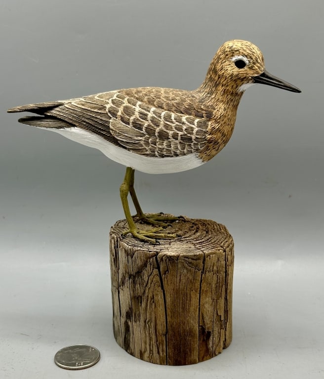 Decorative Sandpiper Carving by Reid Higgins: A 6 inch Peep Shorebird carving by Reid Higgins from Cotuit, Cape Cod, MA, signed and dated 1993 with the maker's paper label on the bottom of the base. In good condition.