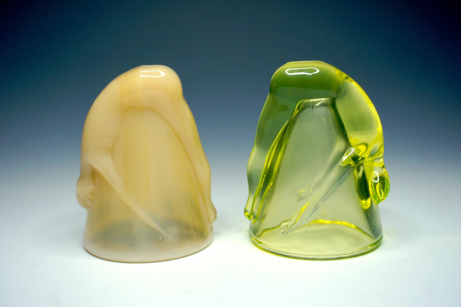Vintage Art Deco nude shot glasses, lot of two: Vintage "bottoms up" shot glasses, pressed glass, vaseline. Patent number on the tan cup 77725. 3.5" tall x 2.5" wide. Excellent, nicely kept.