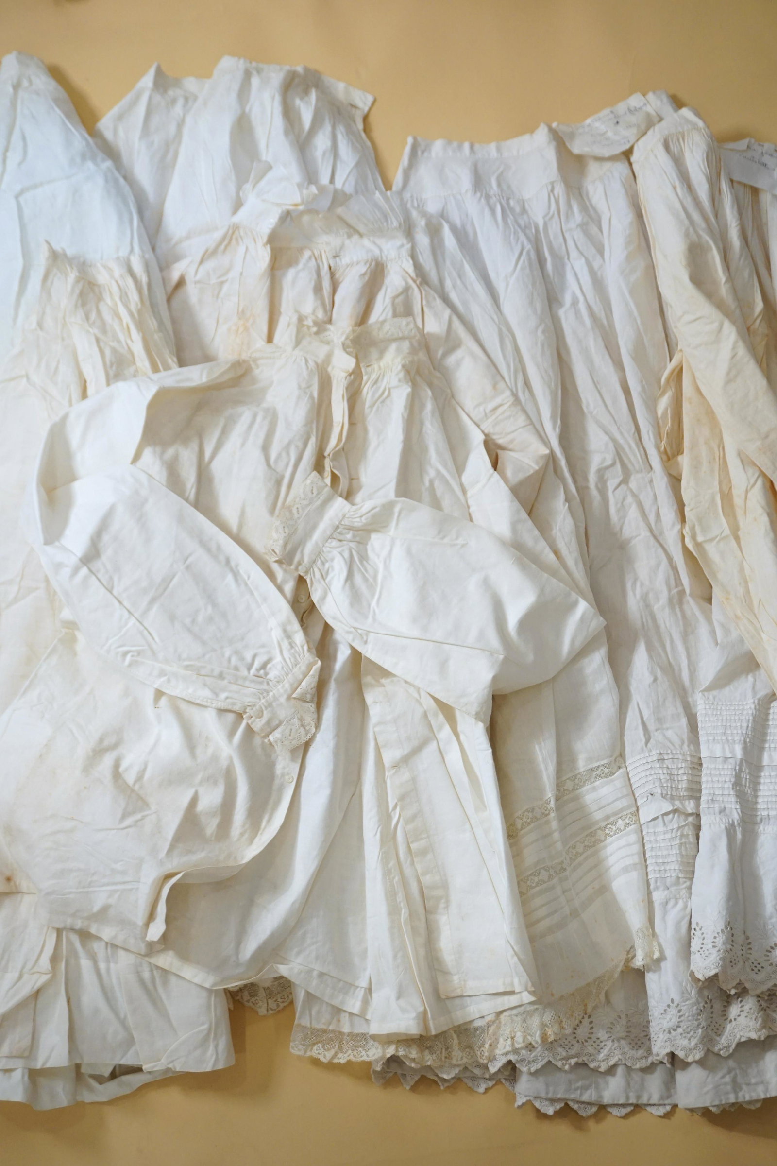 Antique petticoat 1890s skirt grouping: Antique Victorian to 1900s white cotton petticoat skirt grouping. With provenance note. Fair- as acquired with staining. needs cleaning, odor.