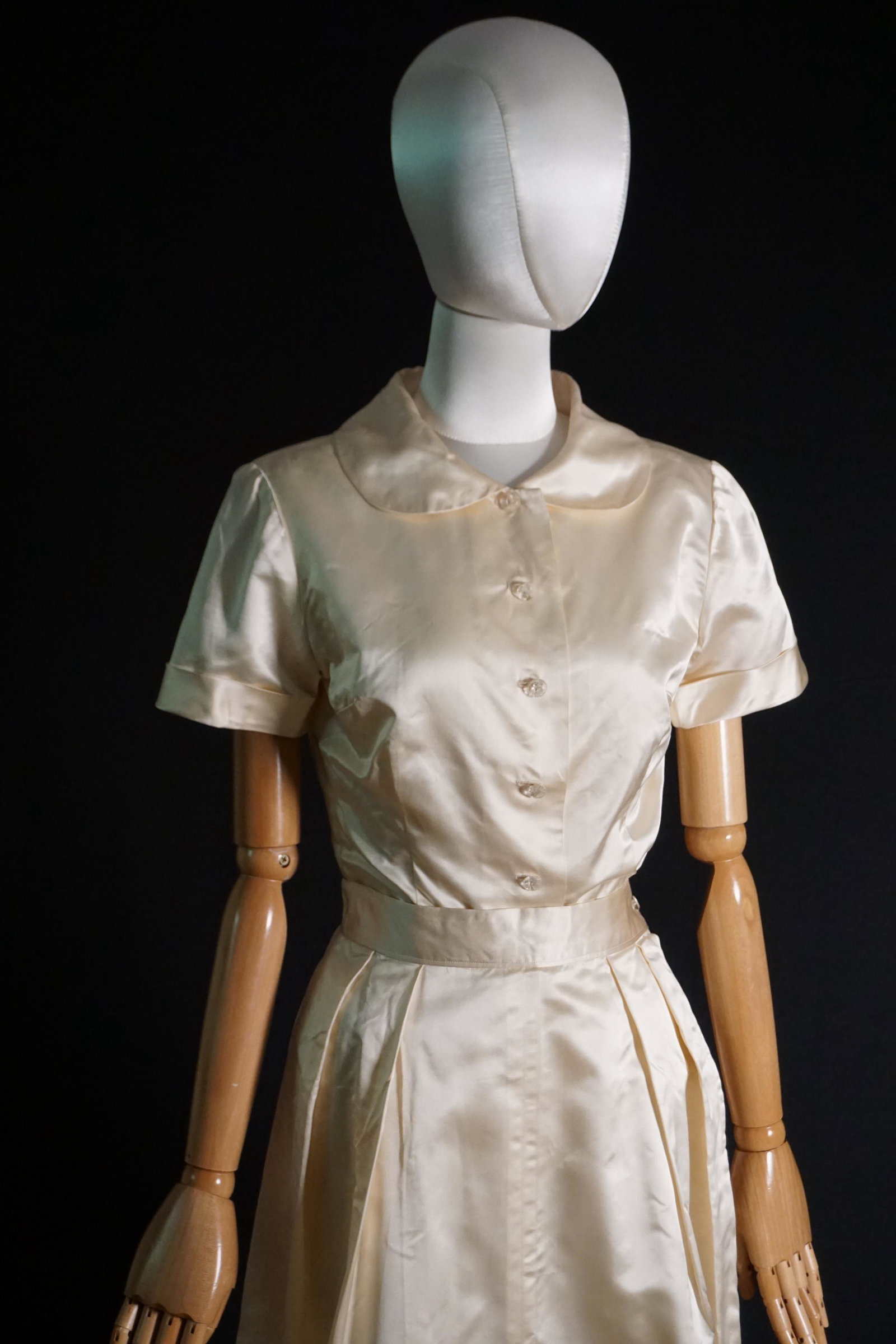 Vintage 1940s 50s ivory satin skirt suit ensemble: Vintage later 1940s to 1950s ivory rayon satin skirt suit. Condition: nicely kept, with flaws and loss to buttons. Measures: 32" bust, 26" waist.
