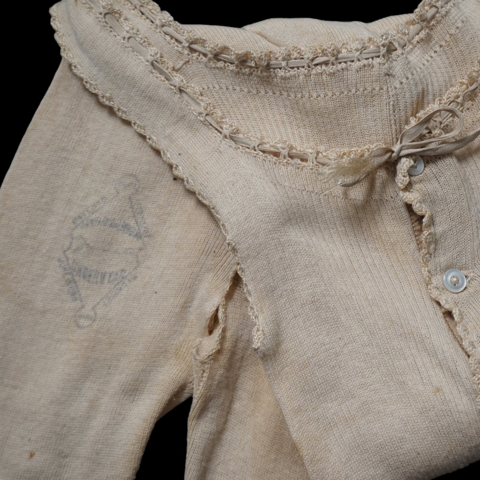 Antique victorian lingerie cotton, wool undergarment onesie: Antique circa 1900 cotton wool blend onesie, sleepwear undergarment. With crochet lace, small ribbon at neckline, mother of pearl buttons and label stamp on the leg. Probably a teen/ youth piece. Meas
