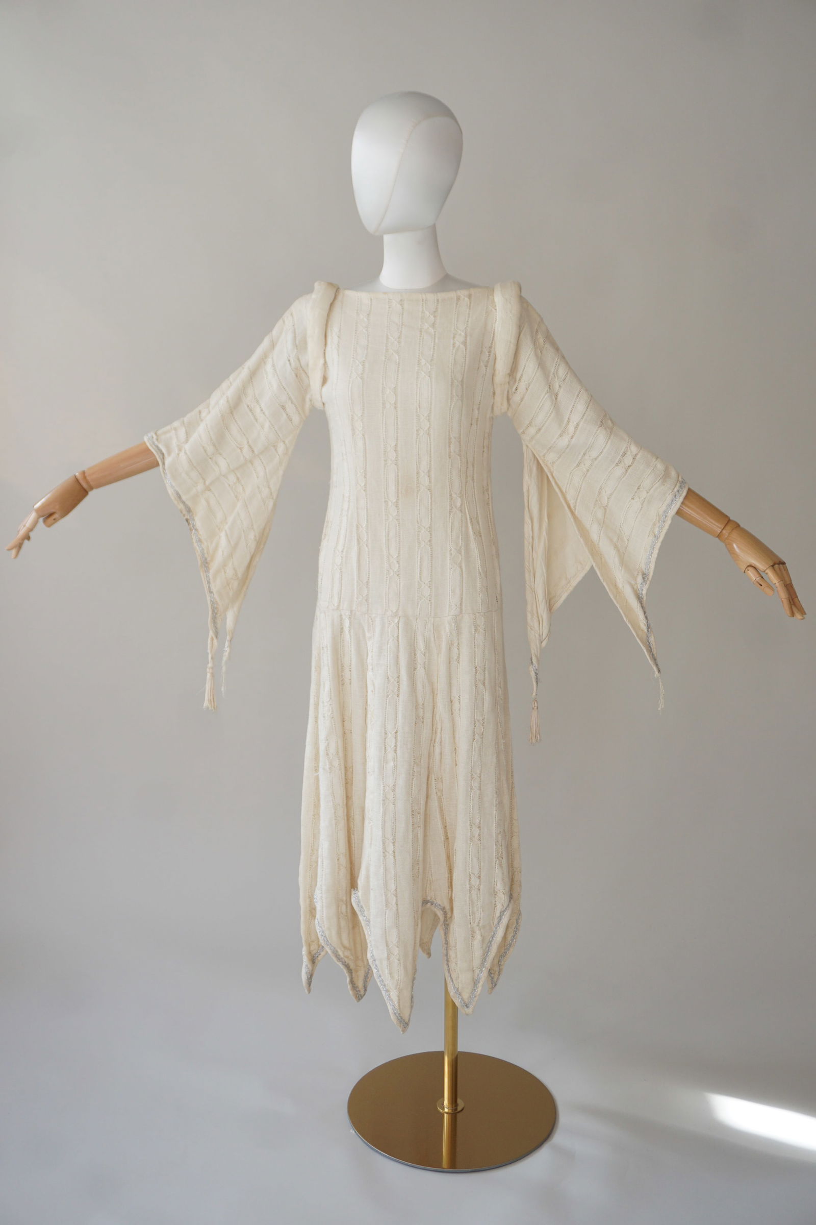 Unusual vintage costume dress, fairy sleeves: Mid-20th century linen costume dress with large flowy fairy-like sleeves with tassels. Drop waist and rolled straps on shoulders. Interior label. Measures: S, 30-32", bust 30", waist 50" length.