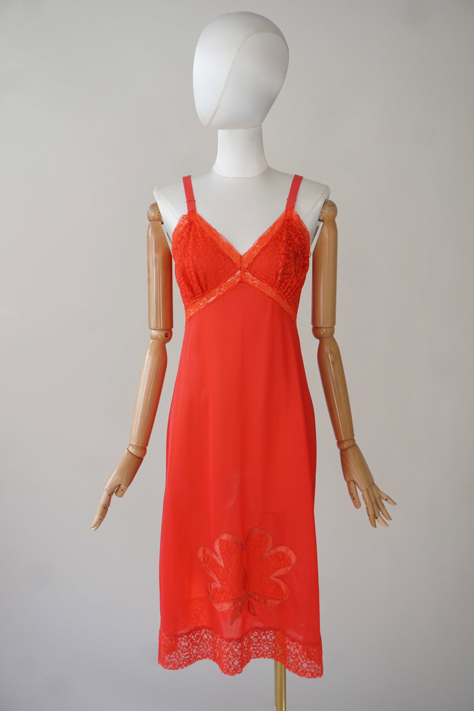 Vintage 1960s red floral lingerie dress: Vintage 1960s vibrant red nylon lingerie slip dress with floral embroideries and lace. Adjustable straps. Measures: 32" bust, 30" waist, 40" length.