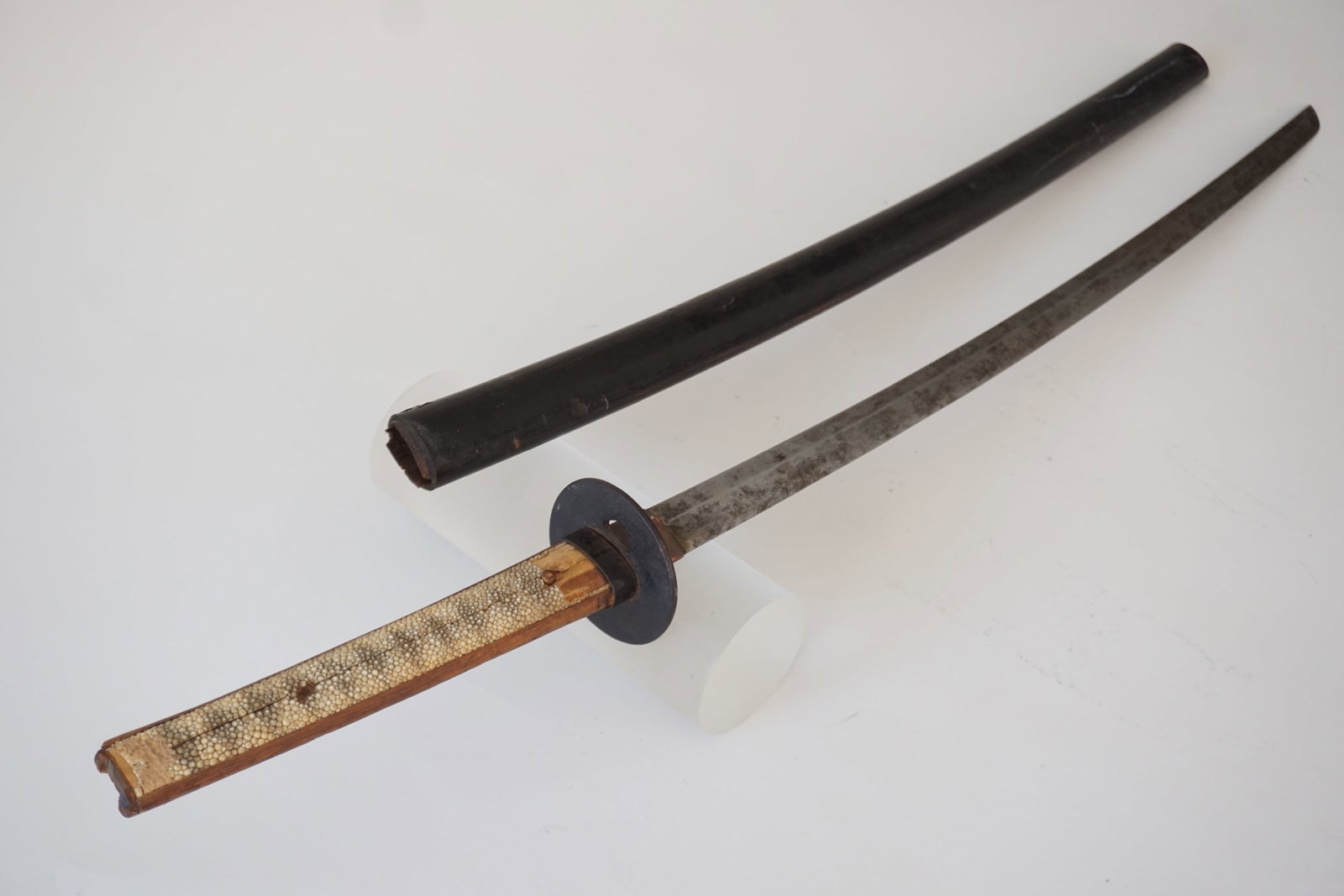 Antique Japanese Kitana / Nihonto, 17th Century: Shagreen handle with black lacquered scabbard. Engraved signature on tang and iron Tsuba. 37.5" total length