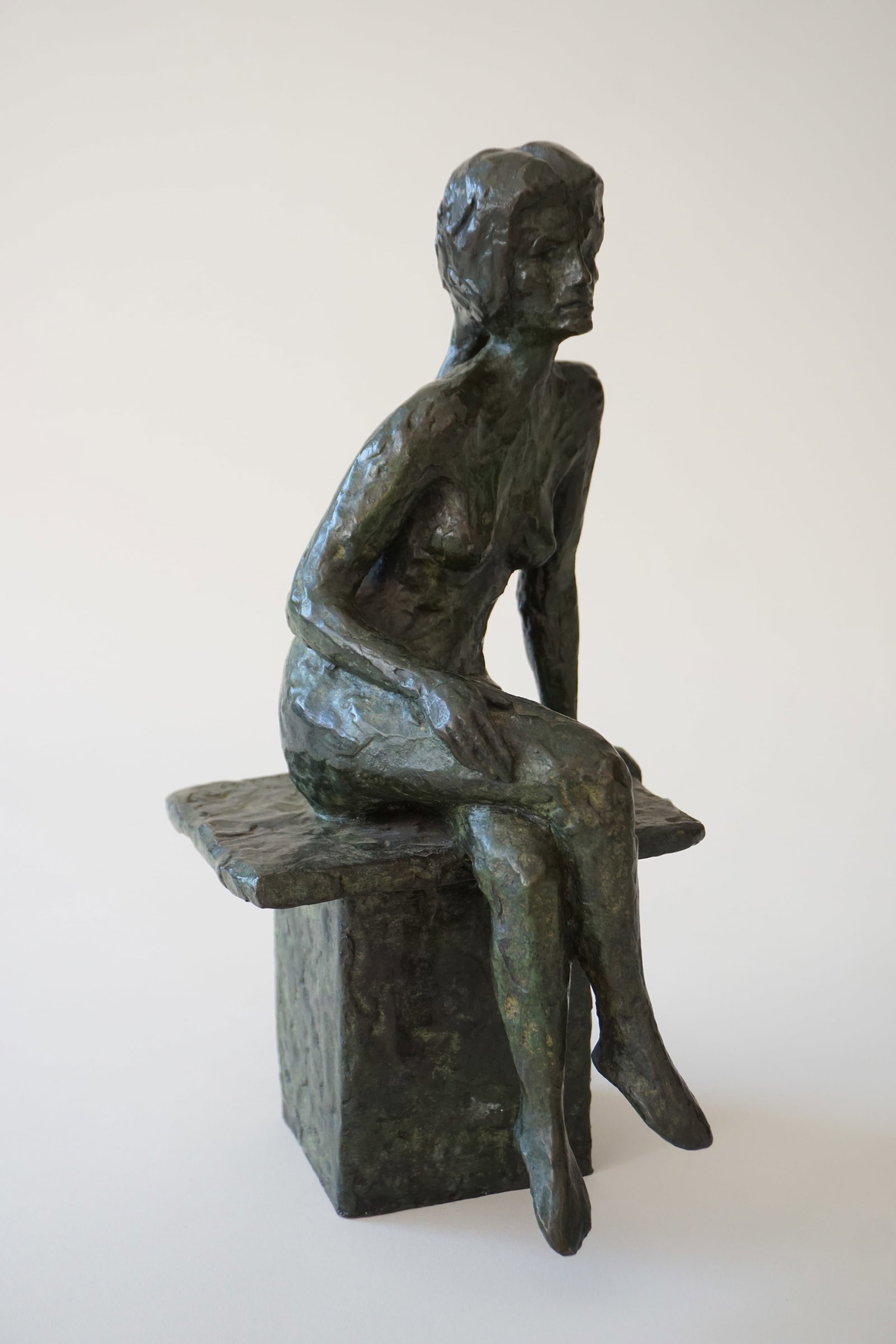 Charles Gagnon bronze statue of nude woman, 1967: CHARLES EUGENE GAGNON 1934 Minneapolis, MinnesotaDepicting a modernist figure of a nude woman sitting on a bench. Heavy and substantial. Signed on the bench with date. 12"