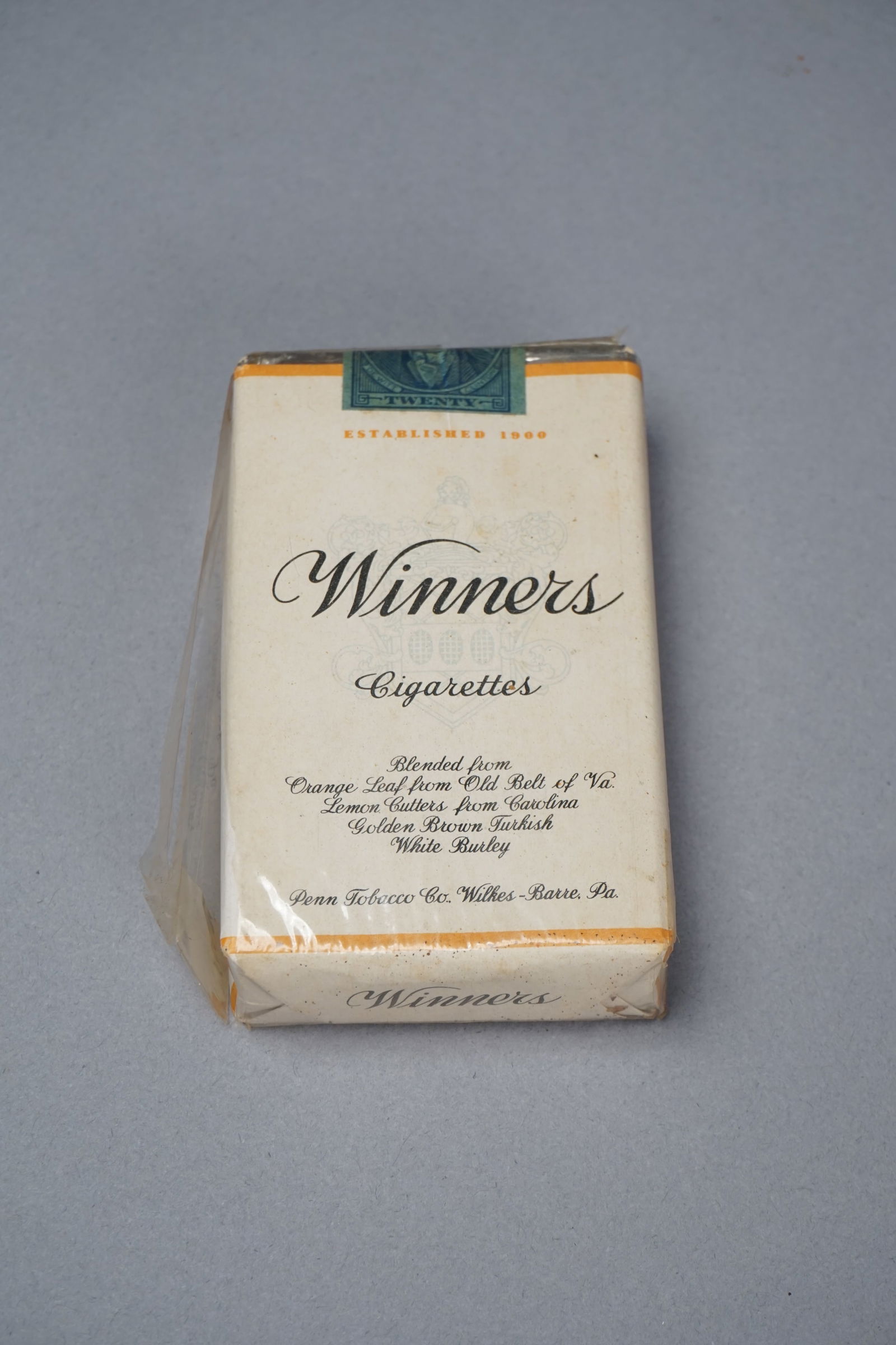 Vintage 1930s Winners pack of cigarettes: Vintage 1930s Winners pack of cigarettes. In original packaging, wrapped in cellophane and closed with stamp, United profit-sharing coupon on back of pack. From Penn Tobacco Co., Wilkes-Barre, PA. Mea