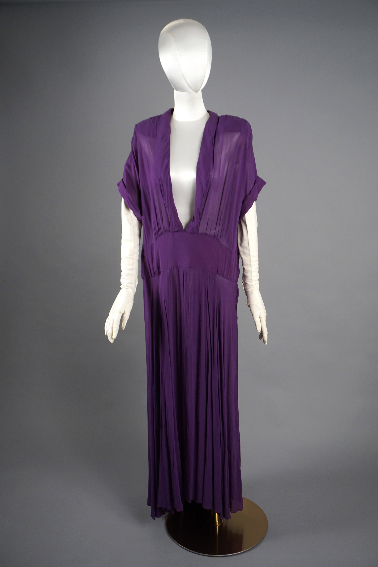 Vintage 1930s 40s Purple Chiffon Dress: This vintage purple chiffon dress dates to the 1930s-1940s and features a dramatic plunging V-neckline, softly gathered at the bust, creating a flowing drape that extends into a floor-length skirt. Th