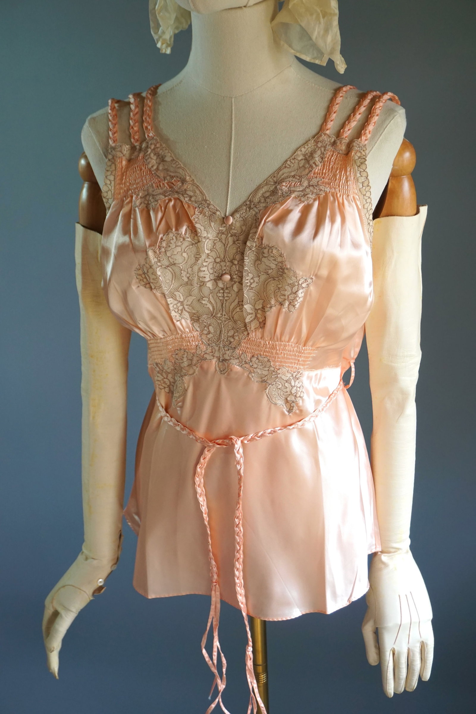 Vintage 1920s 1930s Lingerie Pink Rayon Satin Lace Negligee Blouse: A vintage lingerie blouse from the late 1920s- 1930s, beautifully crafted from soft pink blush-toned rayon satin with intricate lace detailing. This delicate piece embodies the romantic elegance of th
