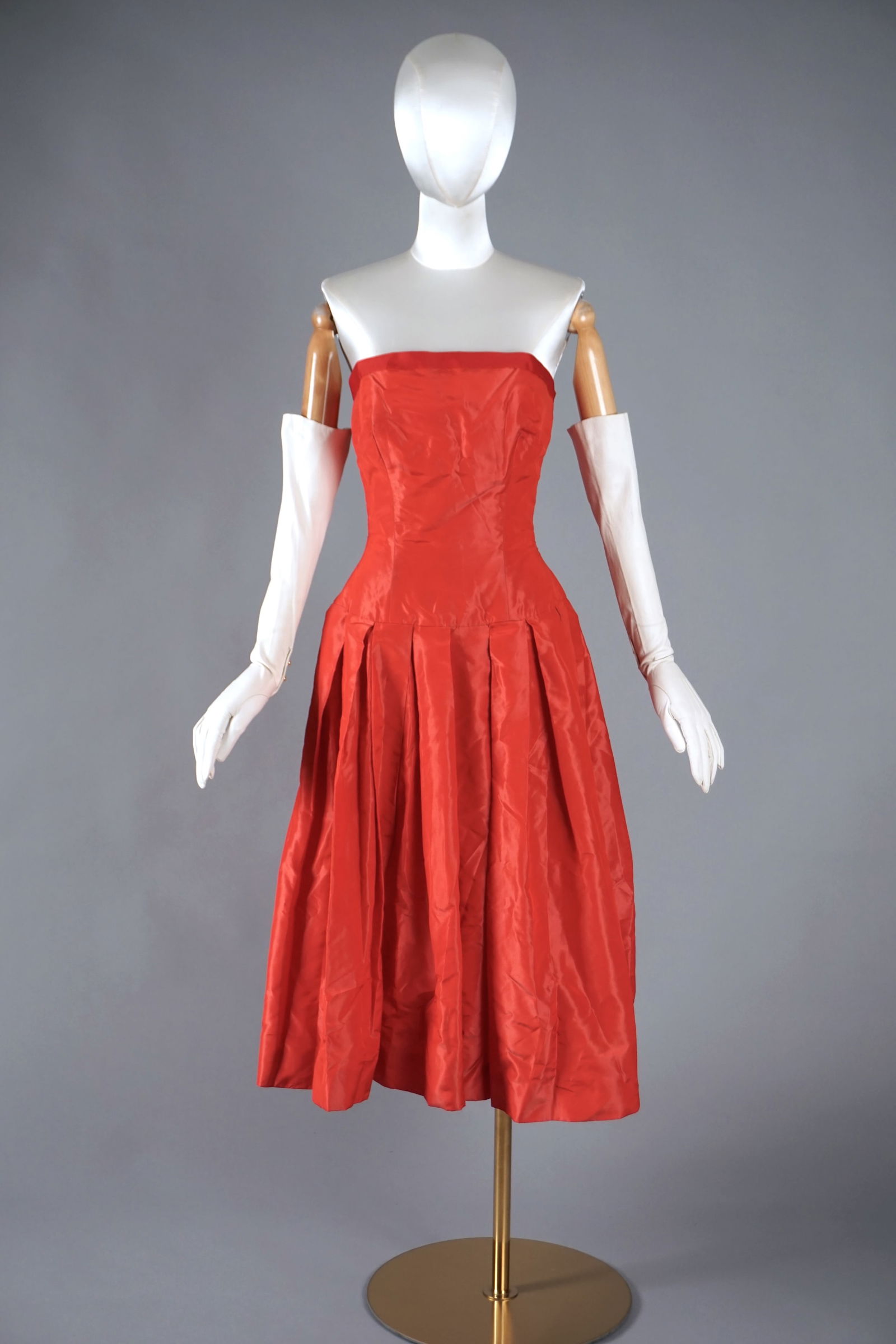 1950s Red Silk Taffeta Party Dress by Marshall Field & Company, Boned Bodice: Vintage 1950s strapless cocktail or party dress in vivid scarlet silk taffeta, sold by Marshall Field & Company’s “Young Chicago” line. This classic fit-and-flare silhouette features a boned