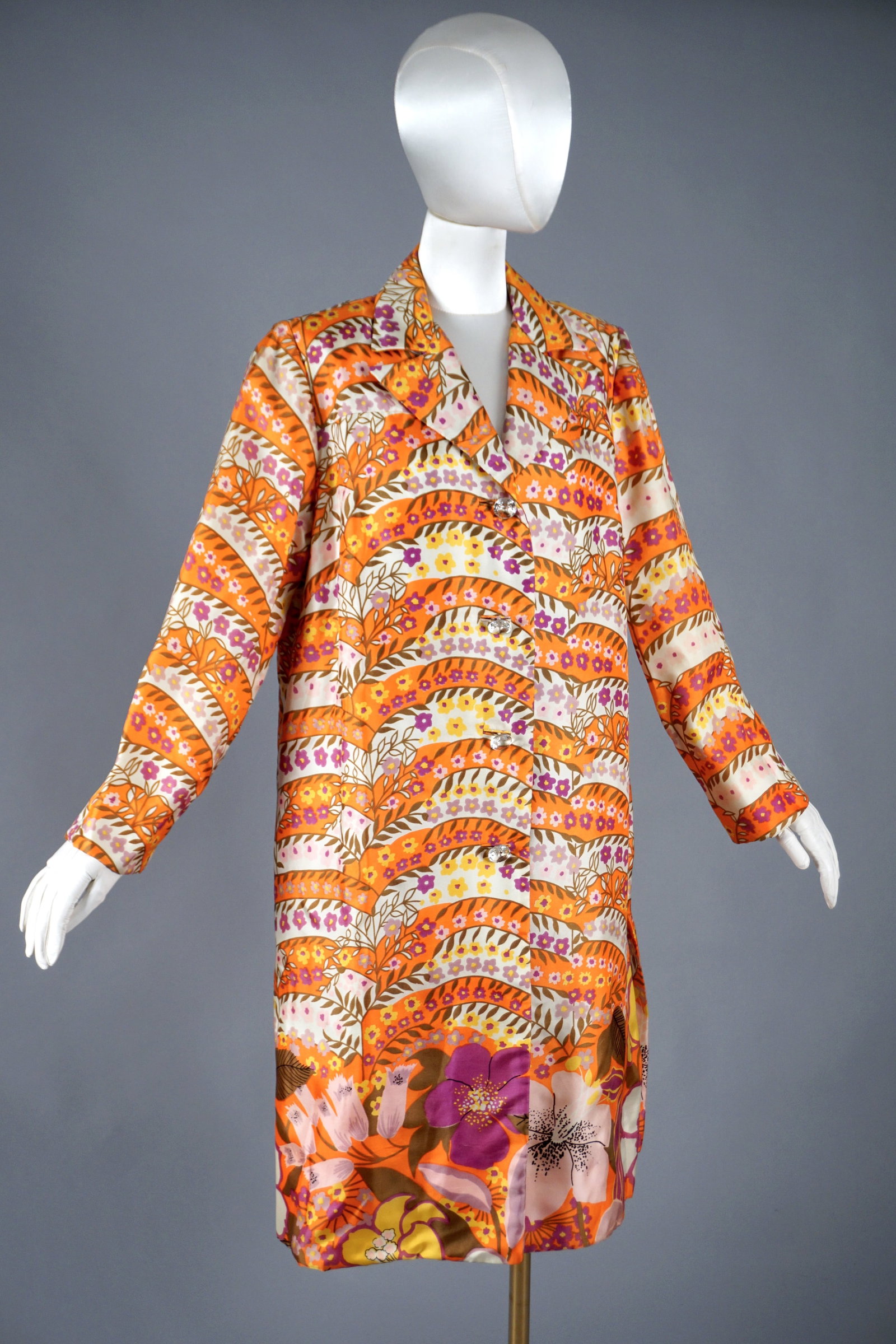 Vintage Herbert Levy Psychedelic Floral Coat, 1960s, Mod Satin Print with Crystal Buttons: A wonderful vintage 1960s Herbert Levy coat in a bold psychedelic floral satin print—bursting with orange, fuchsia, violet, and golden yellow. This A-line coat features clear faceted crystal buttons