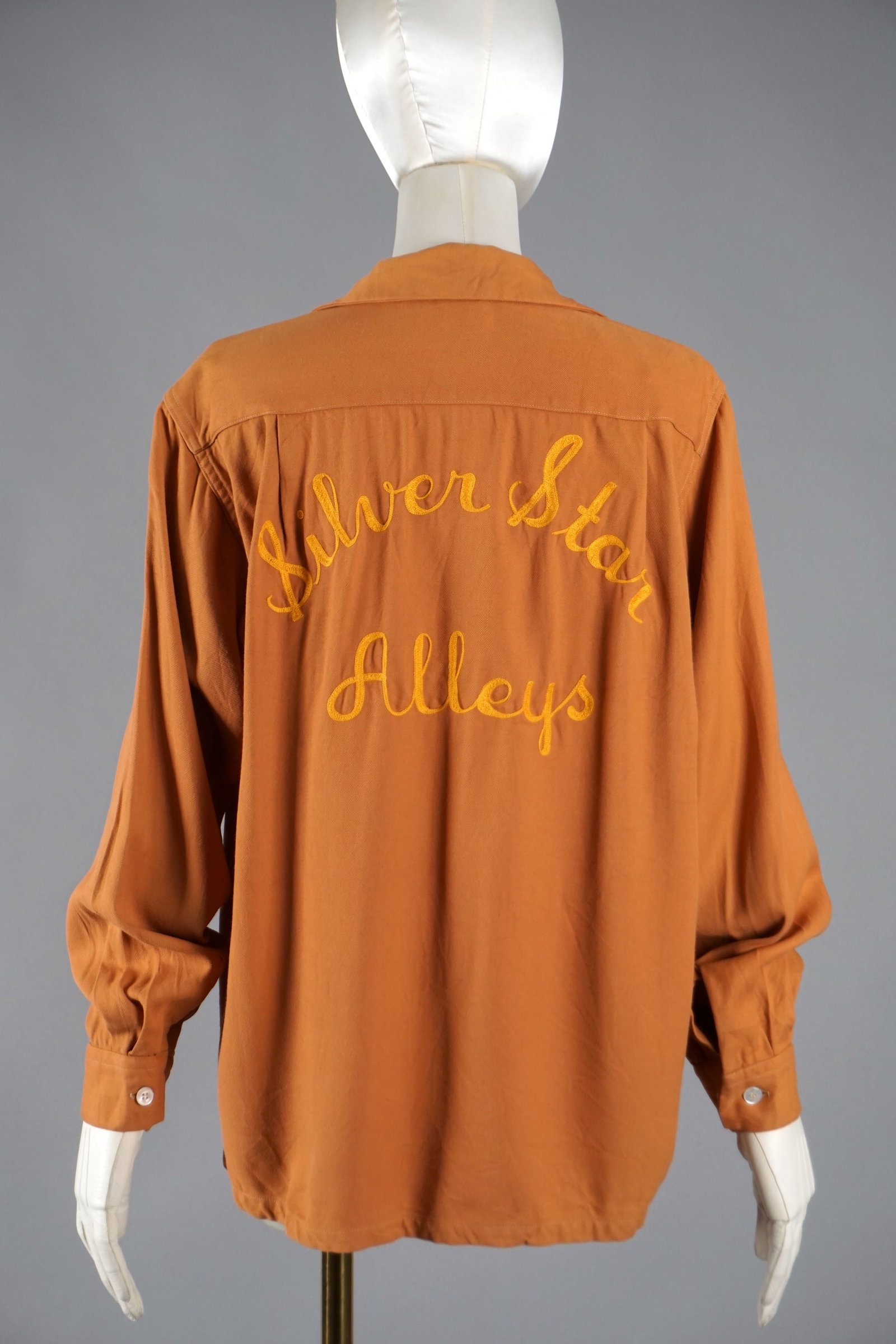 1940s 1950s Men’s Chainstitch Bowling Shirt "Ray" & “Silver Star Alleys" MacLaren Label: Vintage American leisurewear, this chainstitch-embroidered bowling shirt dates to the late 1940s or early 1950s. Rendered in soft, rust-toned rayon with a beautiful drape, it features “Silver Star A