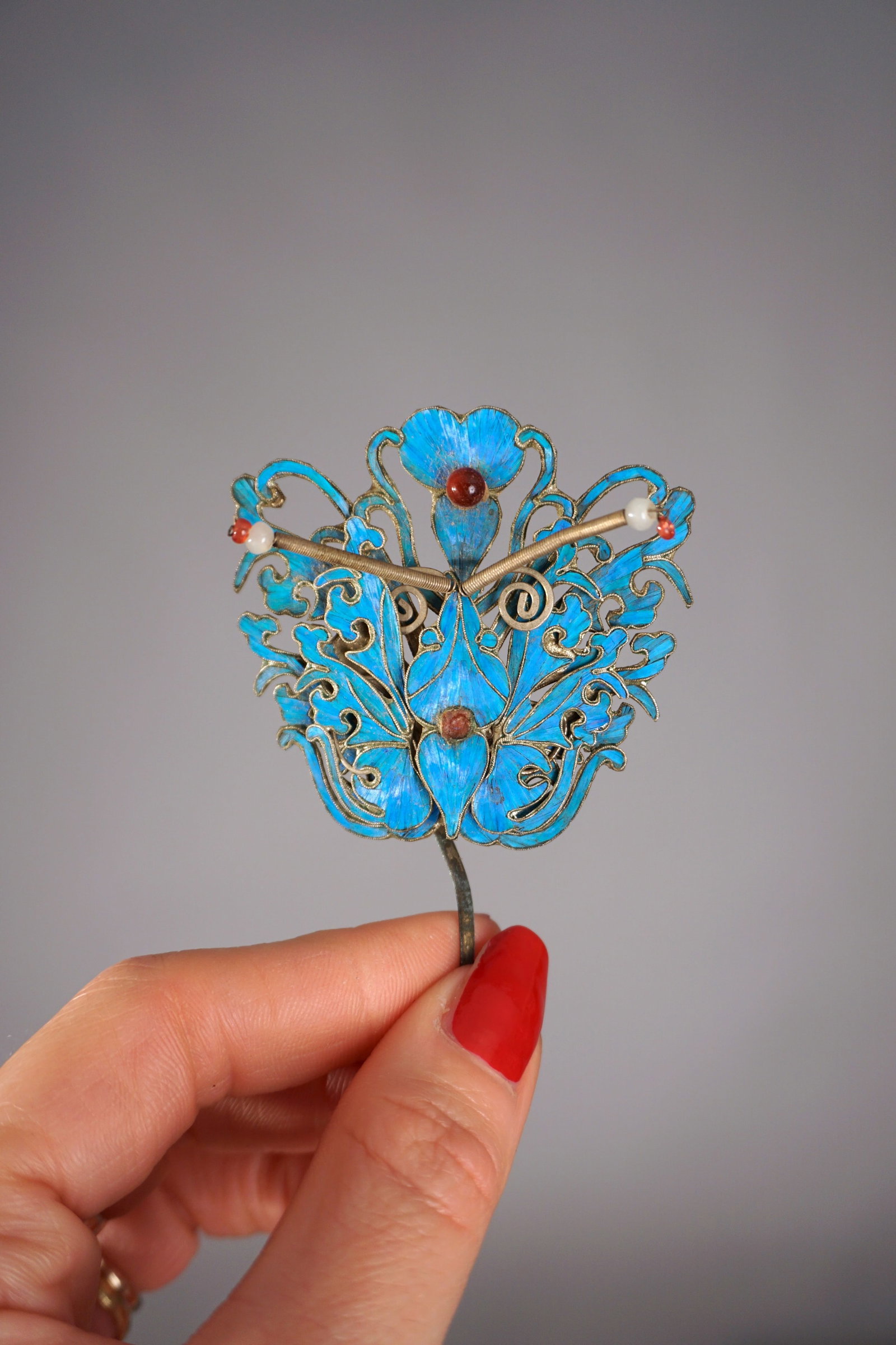 Chinese Kingfisher Butterfly Hairpin with Stones (2): Antique 19th century Chinese Kingfisher feather butterfly hairpin ornament with stones/ jewels. Measurements: 2.5” wide x 2.5” tall x 3.75” total length.