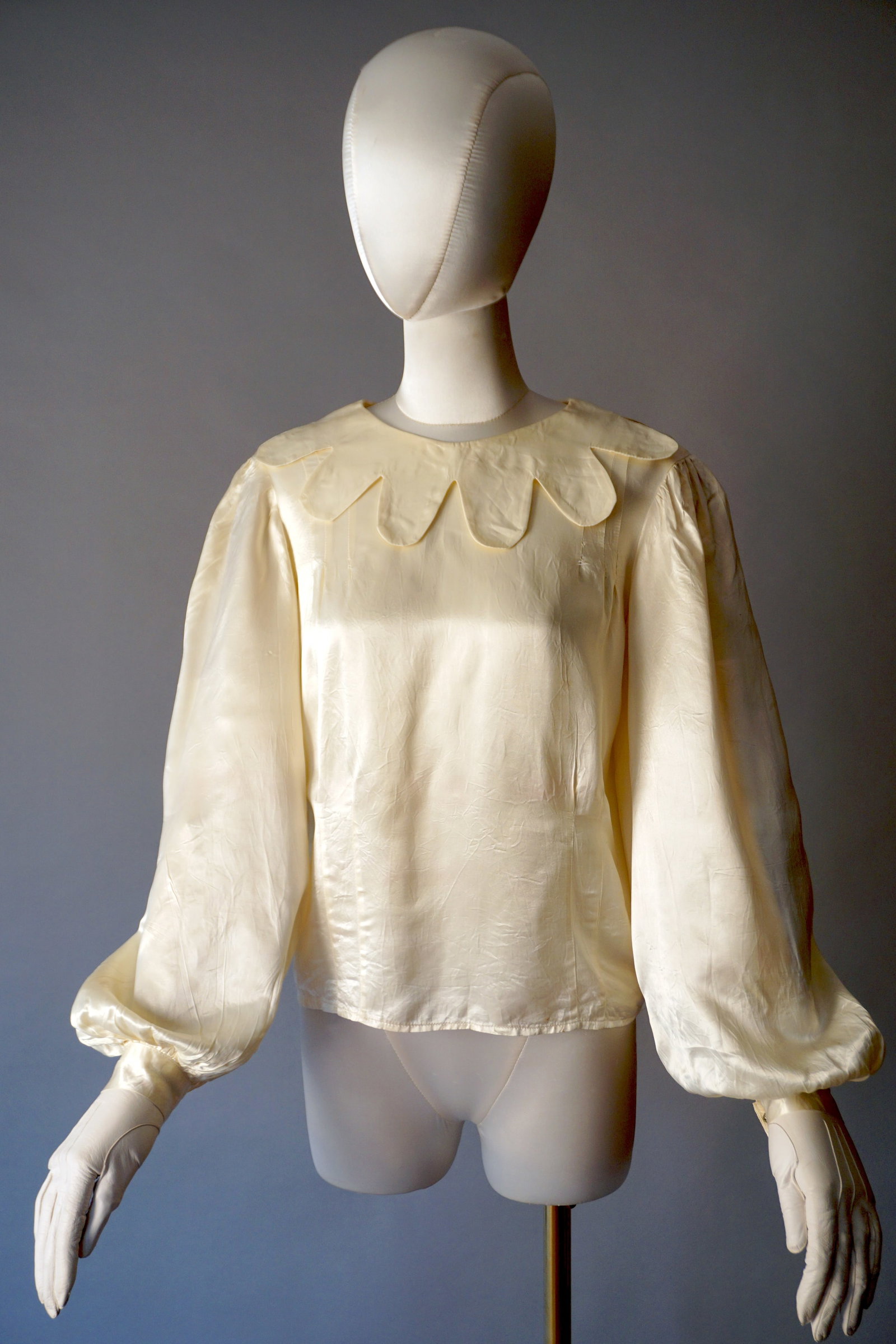 Vintage 1940s Liquid Satin Blouse with Scalloped Neckline & Balloon Puff Sleeves: 1940s liquid satin rayon blouse with a wonderful scalloped neckline, voluminous puffed sleeves, and snap closures at the cuffs and along the back. Measurements: 34" bust, 32" waist, 21" length.