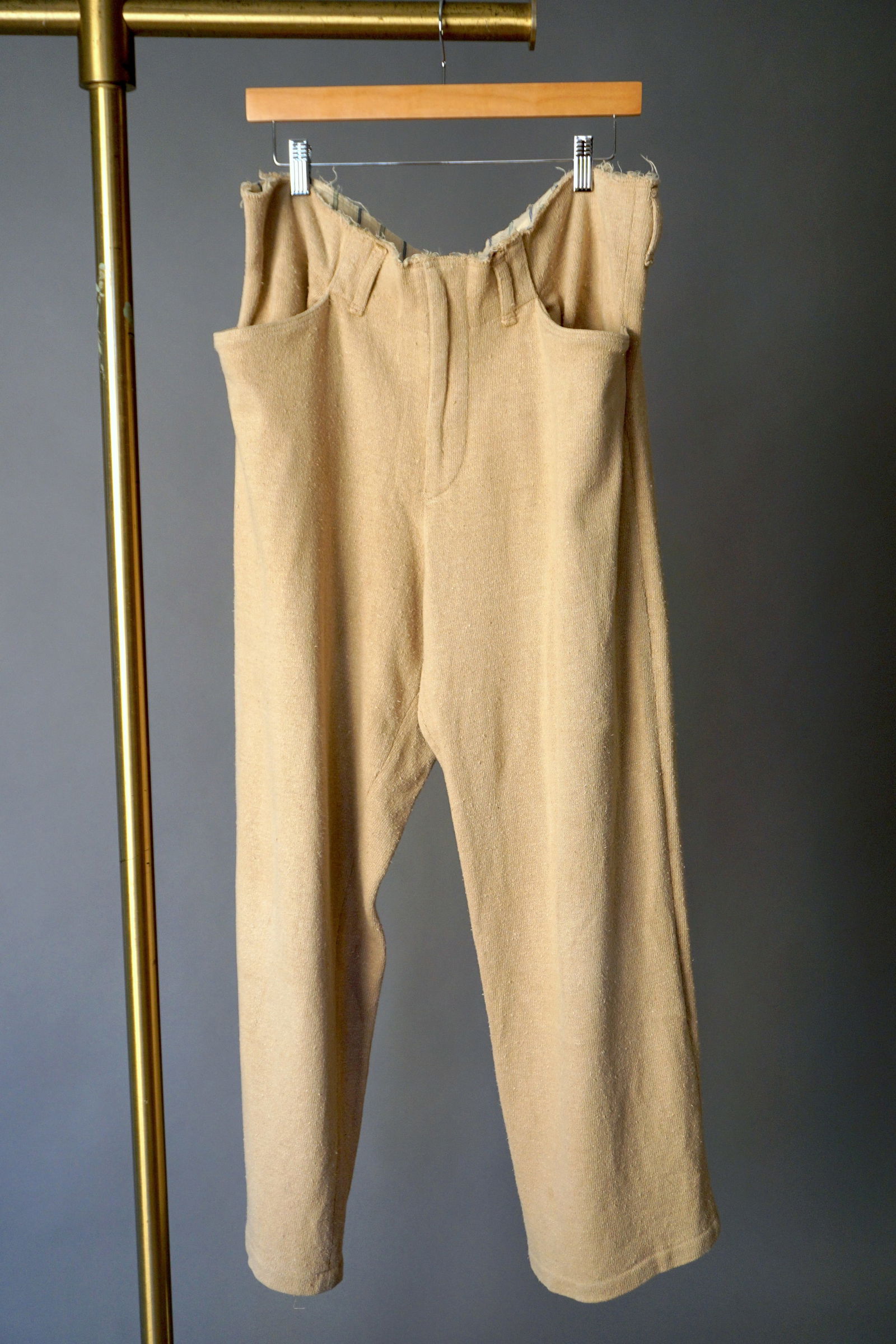 Yohji Yamamoto Y’s Textured Silk Trousers: Yohji Yamamoto Y’s trousers, made in Japan of 100% silk in a textured weave. The fabric is woven in a sandy khaki beige with an organic, handspun quality that gives the garment its distinctive chara