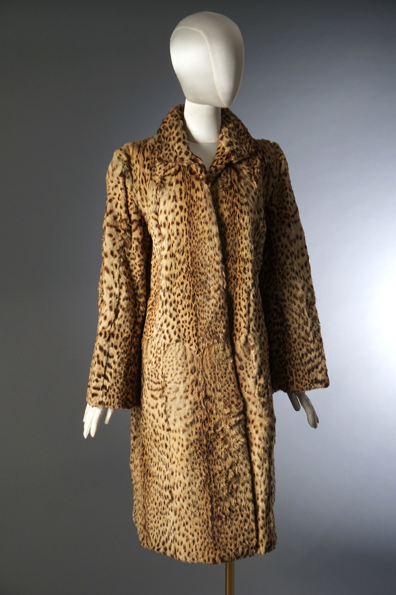 Vintage 1940s 50s Spotted Fur Coat, Cherry & Co. New Bedford: A mid century fur coat dating to the 1940s–1950s, fashioned from beautifully patterned, naturally spotted pelts. The coat is constructed in long vertical panels with a soft, plush hand and warm tawn