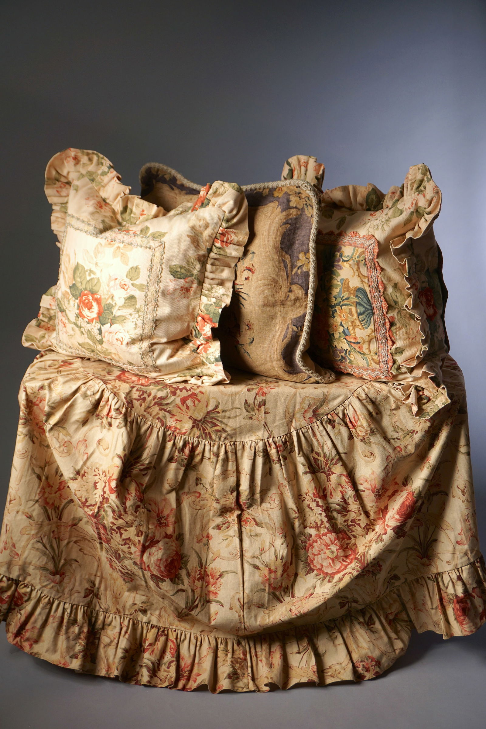 Vintage Floral Cottage Textiles: Ruffled Table Skirt and Three Pillows: This group includes a ruffled floral table skirt and three coordinating vintage cottage style pillows. The table skirt is made from a softly faded floral cotton with a wide gathered ruffle around the