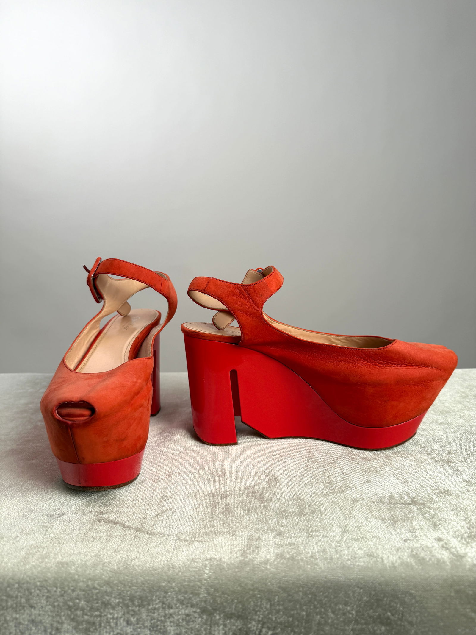 Calvin Klein Collection Sculptural Orange Suede Heels, made in Italy 39: Heels from Calvin Klein Collection, crafted in vibrant orange suede with a subtle peep toe front. The upper is balanced by a bold, architectural lacquered platform and heel, finished with an adjustabl