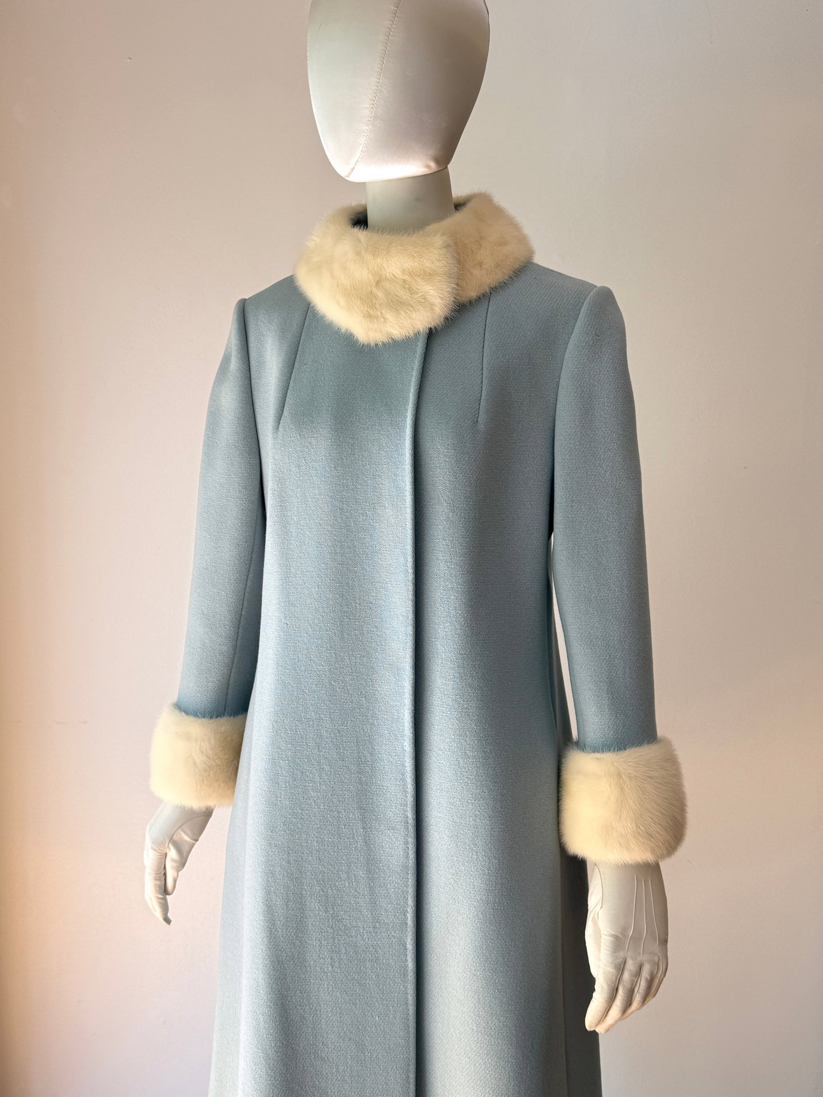 Vintage 1960s Blue Wool Coat with White Mink Fur Collar and Cuffs: Vintage 1960s mid century modern coat in a beautiful powder blue (or Wedgewood blue) fine wool. This piece is a nice example of high end vintage outerwear, featuring luxurious genuine white mink fur t