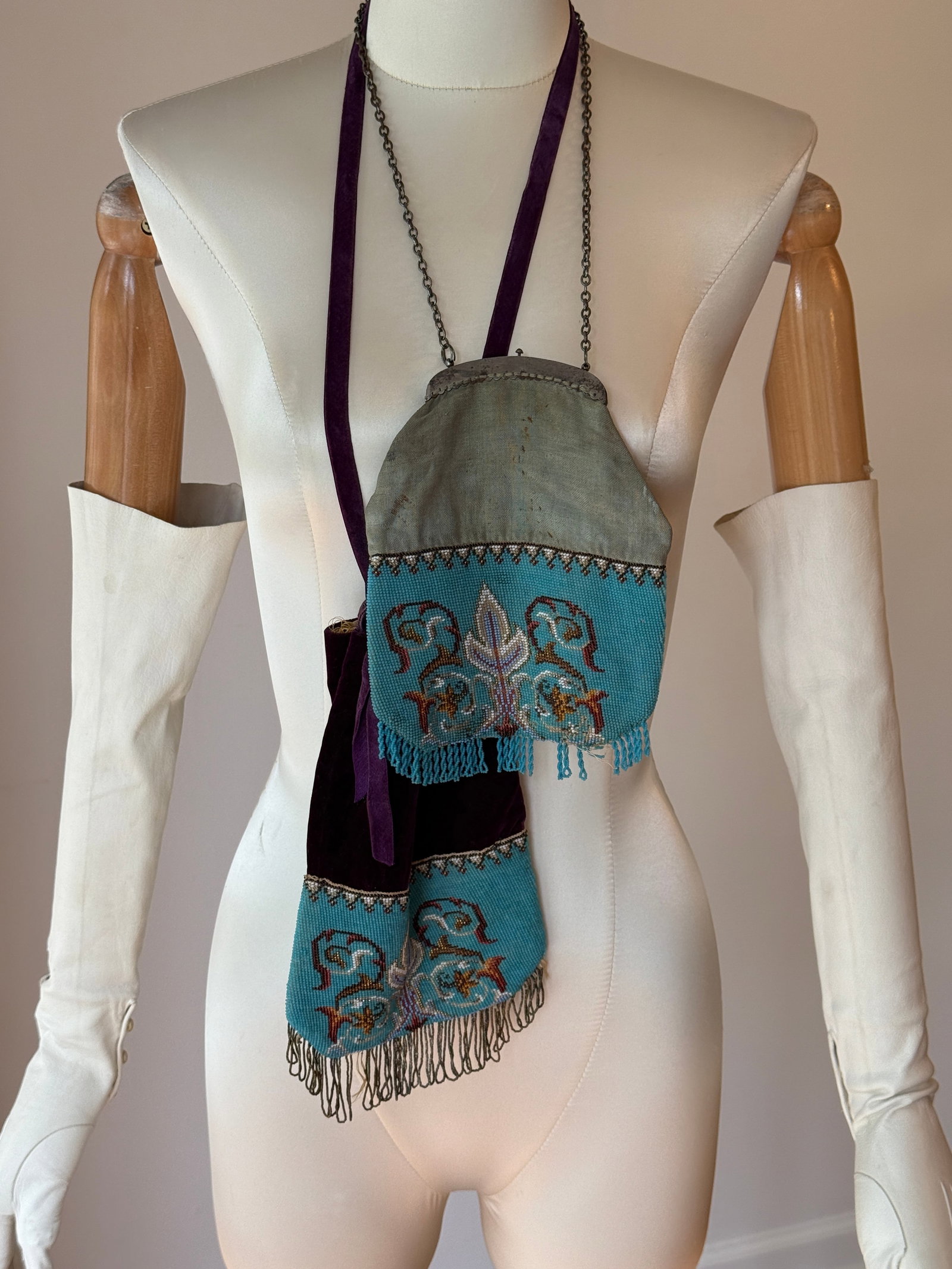 Antique Victorian Micro Bead Handbags, Floral & Velvet Accents, c. 1880: Two antique handbags from the 1880s showcasing intricate hand worked micro beading in a blue stylized floral pattern. One bag is a drawstring style with a deep purple velvet collar; the second feature