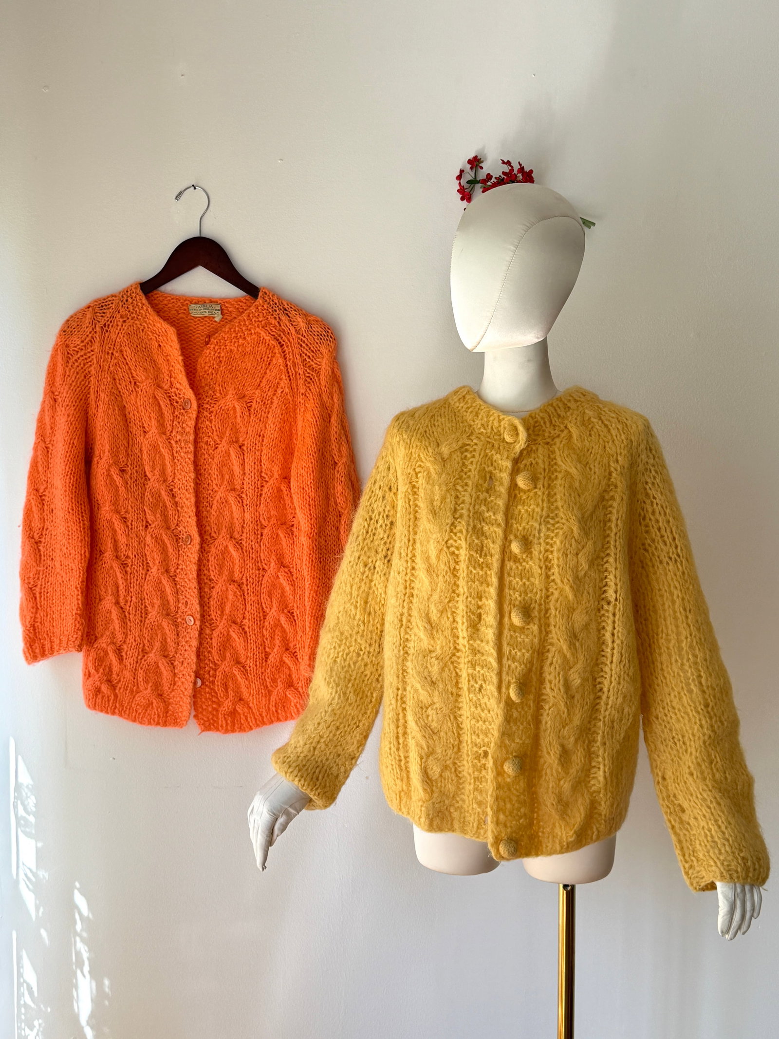 Two Vintage Italian Mohair Wool Cardigan Sweaters, Peach Pink and Apricot: Two vintage mid century Italian mohair wool knitwear sweaters hand knitted in Italy with heavy gauge cable knit construction. The first is a bright neon peachy pink cardigan from the Famelia brand, co
