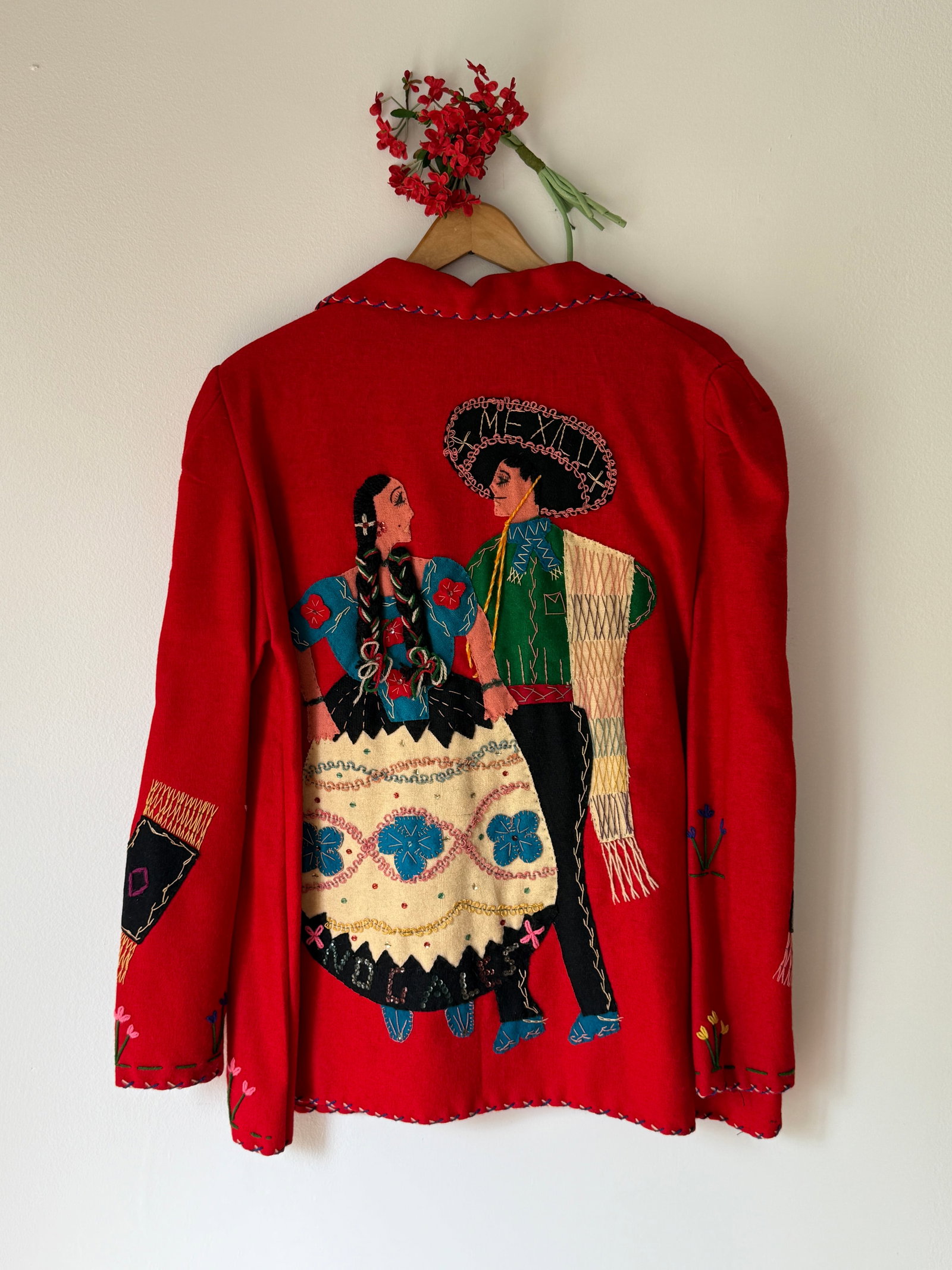 Vintage 1940s 50s Embroidered Wool Souvenir Jacket from Mexico: Vintage Mexican souvenir jacket, likely dating from the 1940s or 1950s, the jacket features elaborate hand embroidery and colorful felt appliqués depicting a traditional dancing couple, with intricat
