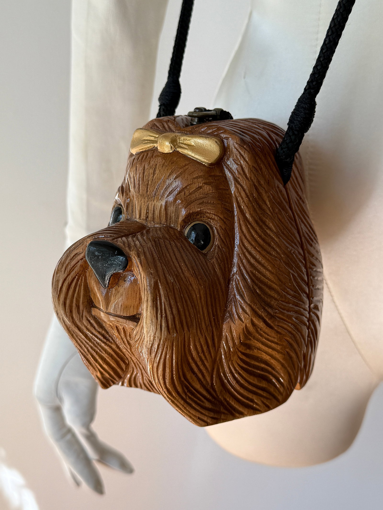 Vintage Figural Yorkie Dog Purse, Timmy Woods Beverly Hills: The Timmy Woods Beverly Hills Collection vintage handmade Yorkie purse shoulder bag made from wood with a black lined exterior. The purse features a Yorkie shape with a brass clasp. Measurements: 6"