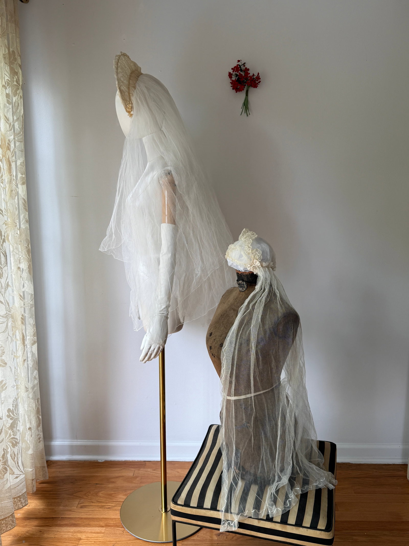 Two Antique Lace Wedding Veils: Two antique wedding veils. One white veil with decorative bows and embroidered scrolling. One tulle and lace crown adorned with small faux seed pearls and plastic wax like flowers at the sides.