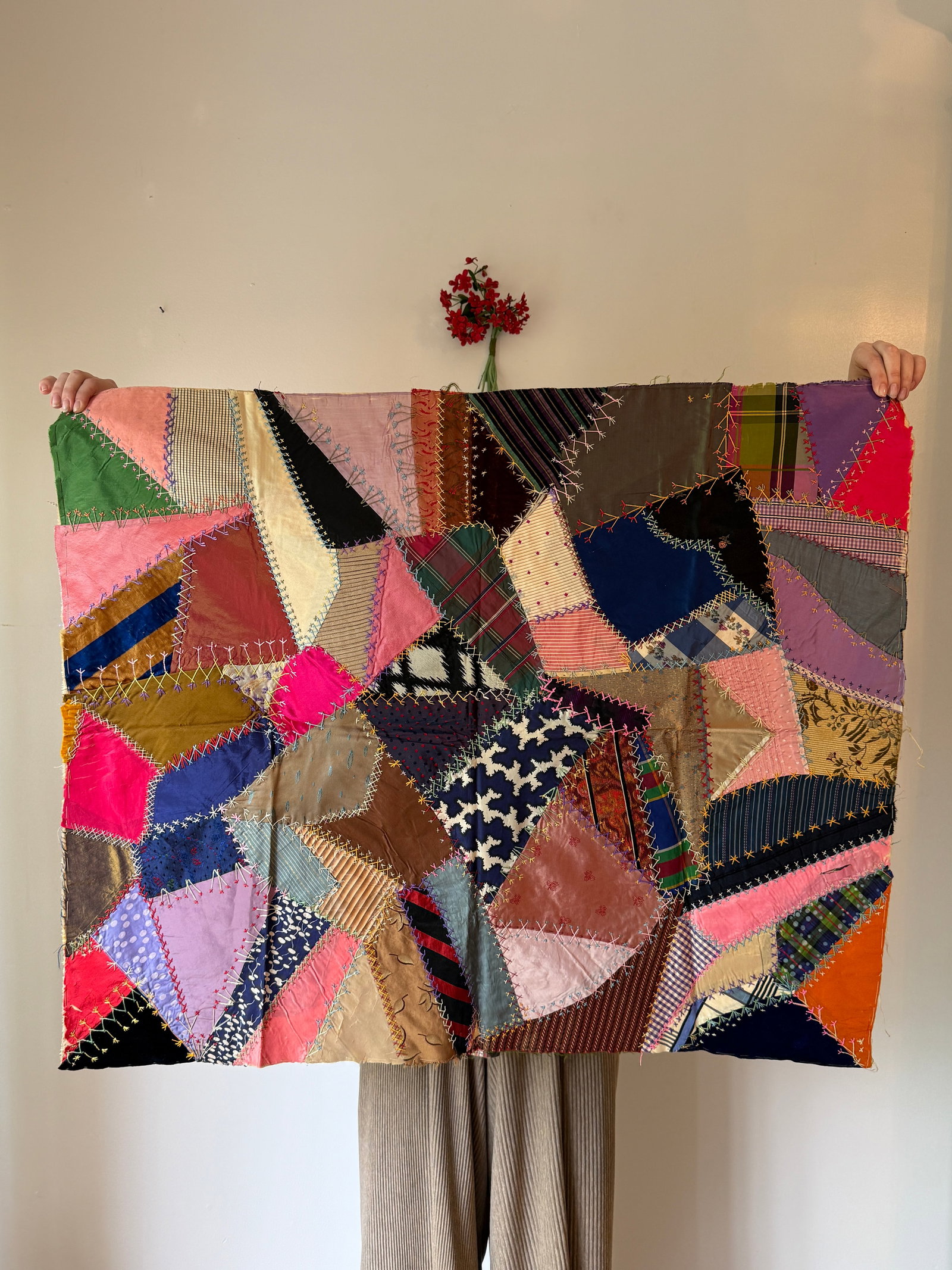 Antique Victorian Silk Crazy Quilt Fragment Textile #2: Antique Victorian era crazy quilt fragment in silk satins, velvets, and brocades in an array of jewel tones and patterns. Each asymmetrical scrap is hand stitched with decorative embroidery, featuring