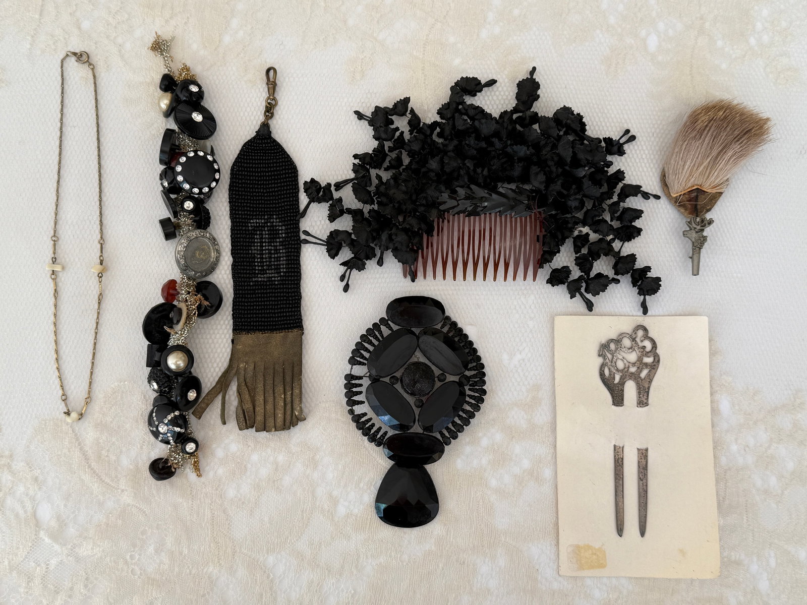 Antique Victorian Mourning & Edwardian Jewelry Accessories Group: Nice group of antique Victorian and Edwardian accessories featuring a large faceted French jet mourning pendant, silver hair fork from 1893, German Gamsbart hunter’s pin with a decorative metal moos