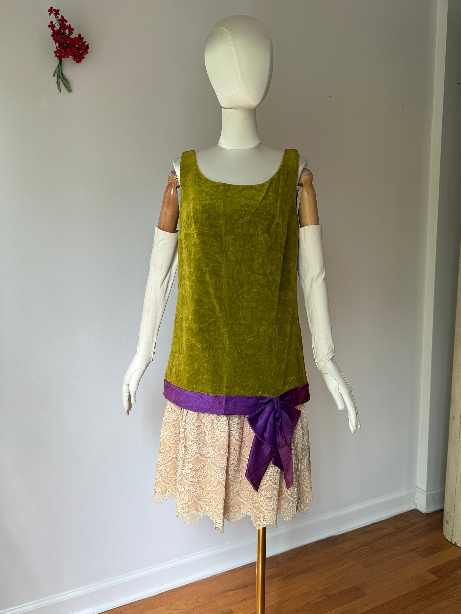 Vintage S. Howard Hirsh 1960s Olive Velvet and Lace Cocktail Dress: Vintage 1960s dress by California designer S. Howard Hirsh in an olive green velvet bodice with a royal purple satin sash and bow drop waist, transitioning into a delicate, tiered cream lace skirt. Me