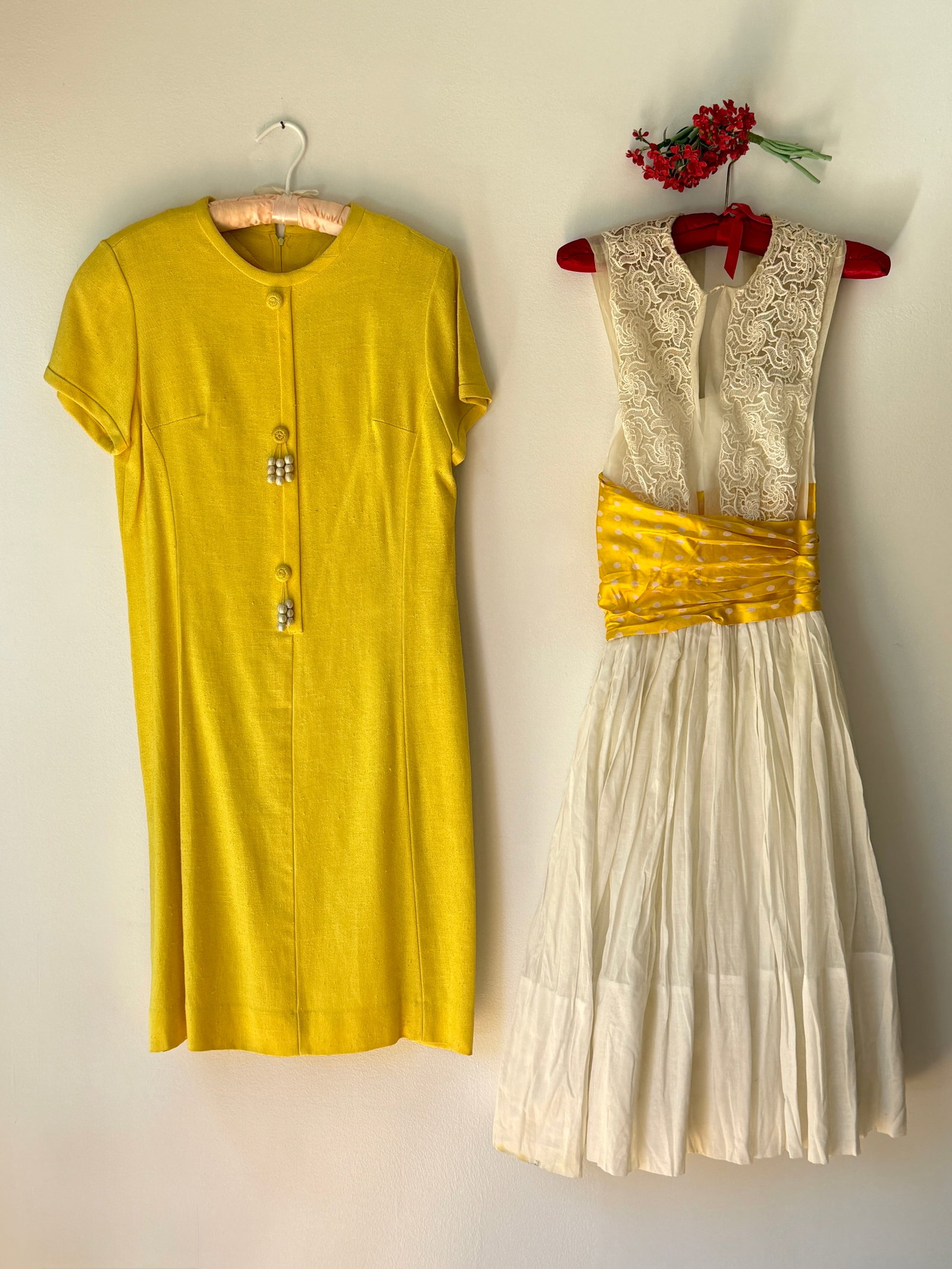 Two Vintage 1950s 60s Dresses, Lace & Yellow Mod Linen Tassel: Two mid century ladies dresses in vibrant tones. The first is a white cotton sundress from the late 1950s or early 1960s, showcasing a romantic white lace bodice and a bold, wide yellow sash at the wa