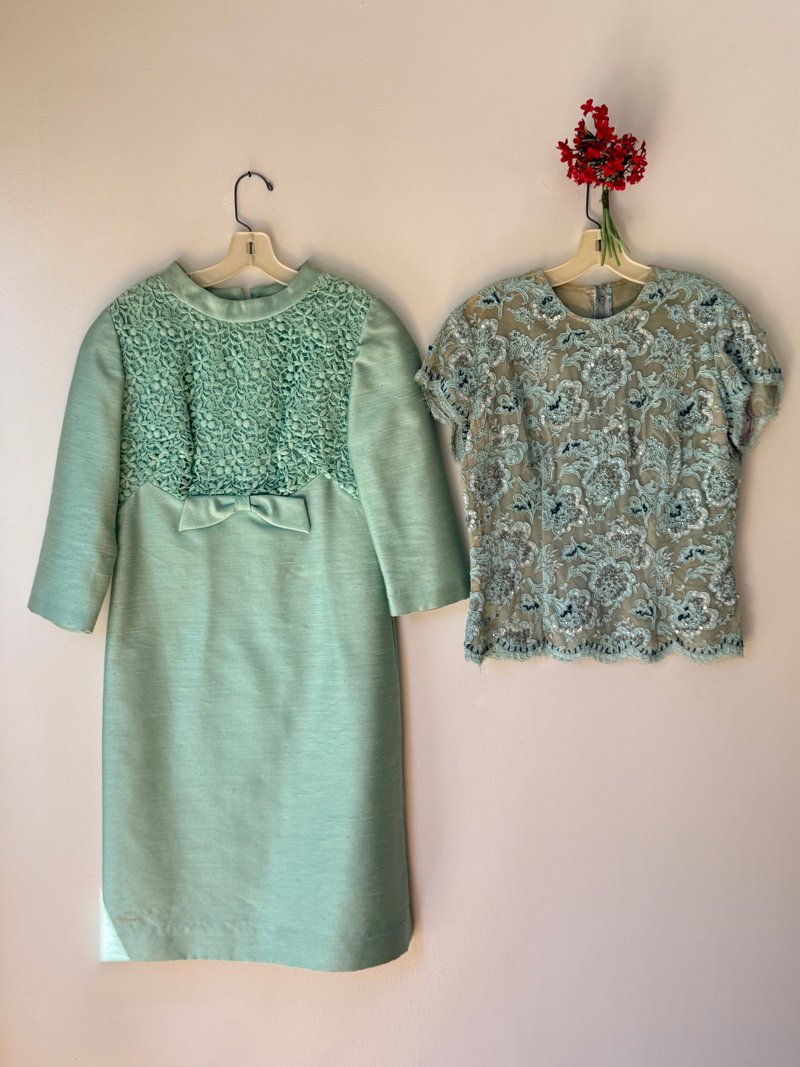 Two Vintage Mid Century Aqua Blue Dressy Outfits: Two formal ladies dress from the mid century, presented in coordinating shades of aqua blue. The first garment is a late 1950s to early 1960s cocktail dresscrafted from a textured silk or rayon faille