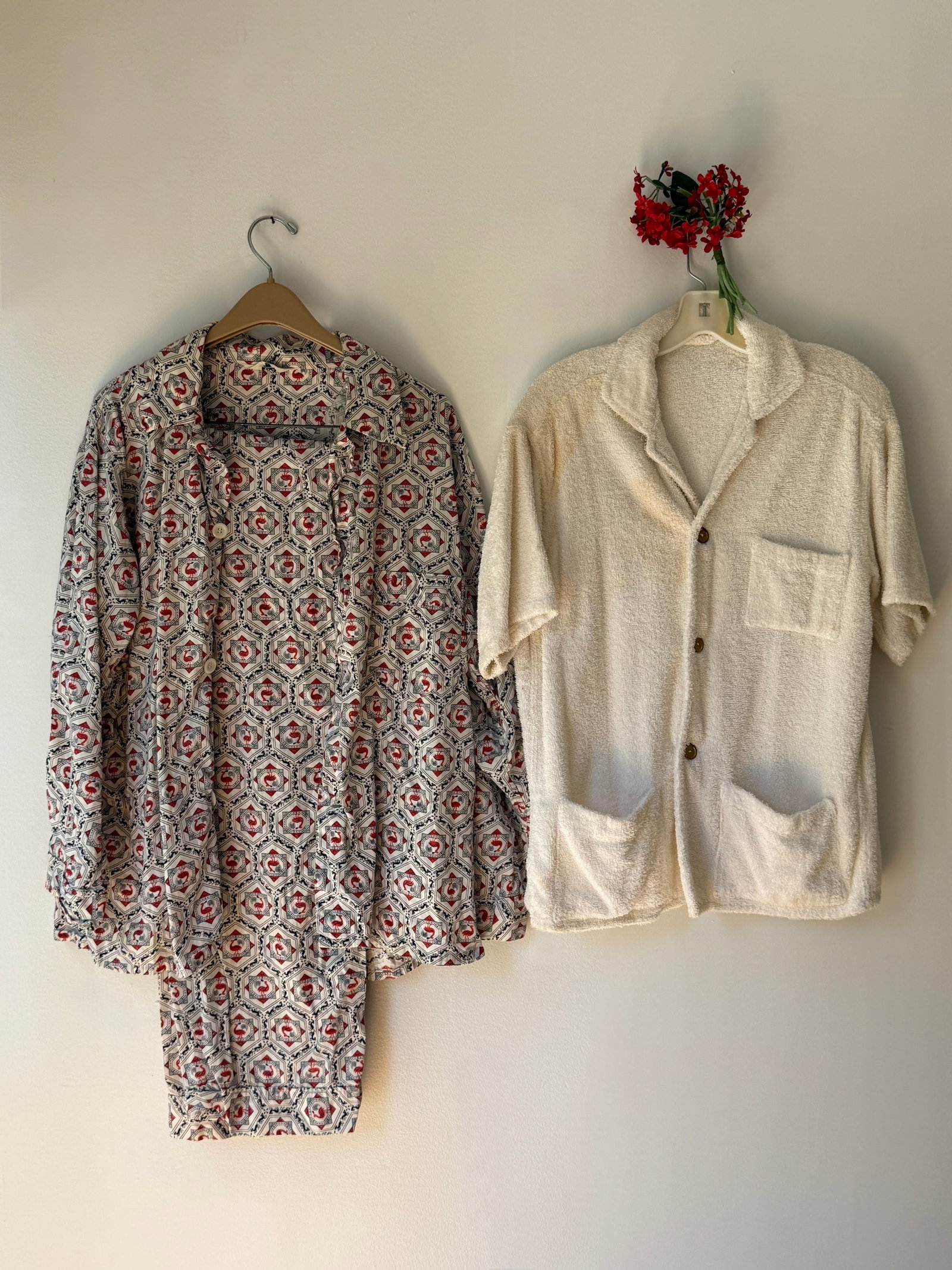 Lot of Two Vintage Men's Loungewear 1960s Terrycloth Beach Shirt & Patterned Pajama Set: This lot features two pieces of men’s vintage loungewear from the 1950s and 60s. The first is a terrycloth beach shirt with textured, bouclé like knit, a relaxed camp collar, a button down front, a