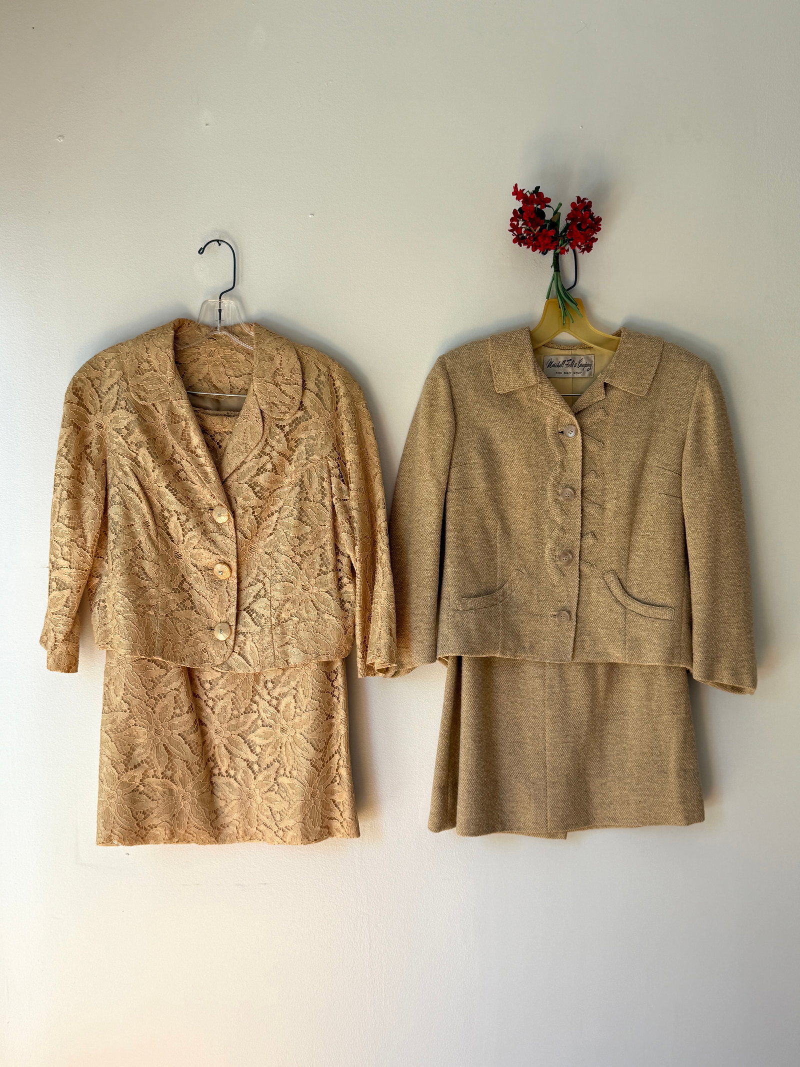 Lot of Two Vintage 1950s Suits Floral Lace and Marshall Field's Tweed Skirt Set: Two tailored vintage skirt suits from the 1950s, a tan floral lace suit featuring a structured three button jacket with a rounded collar and bracelet length sleeves paired with a matching skirt. The s