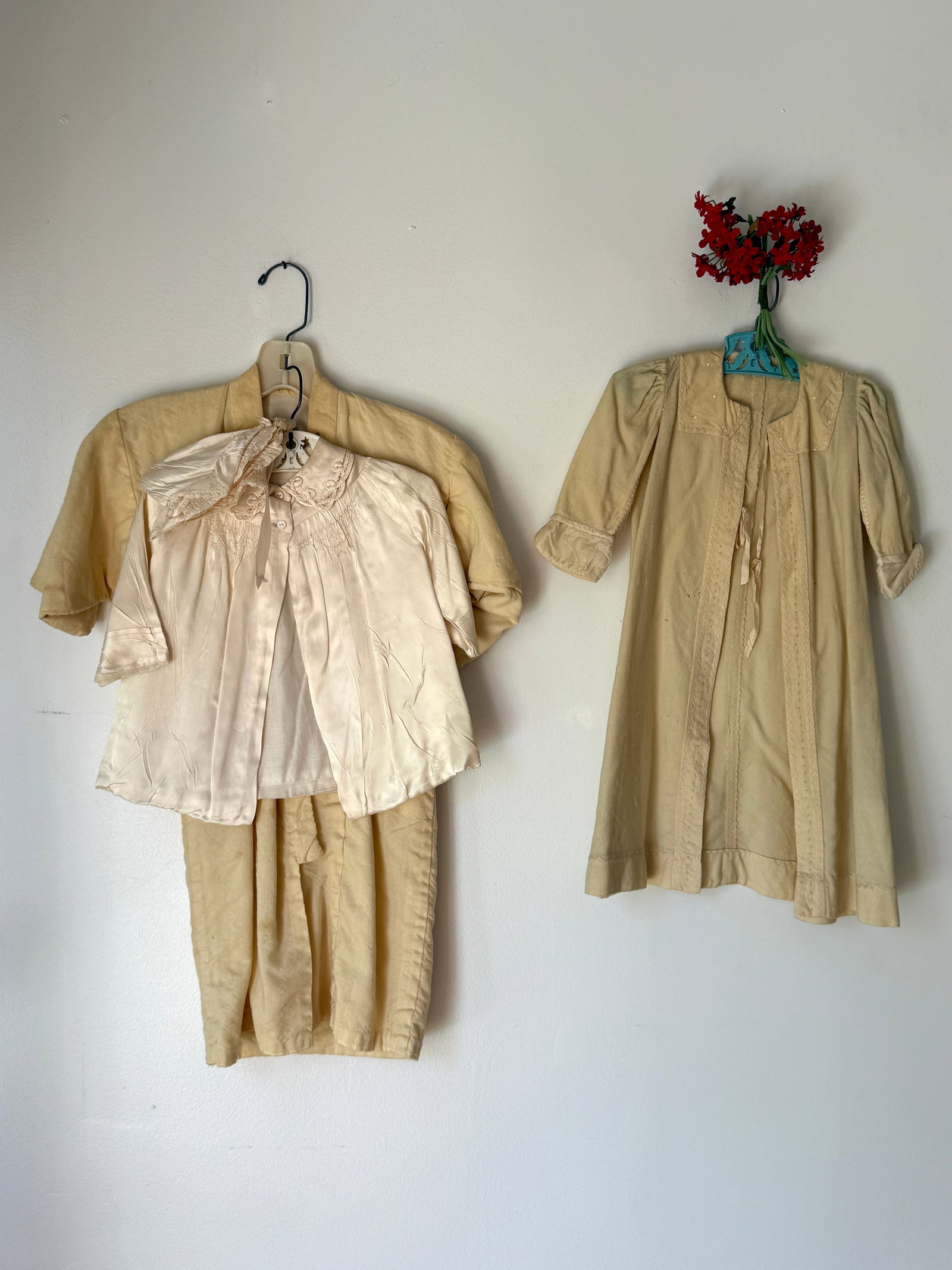 Group of Three Antique Baby Clothing Items, Christening Dress, Victorian Robe and Kimono: Group of three pieces of antique baby clothing pieces, antique satin christening outfit with hat, yellow small child's Victorian era jacket, and turn of the century yellow kimono jacket.