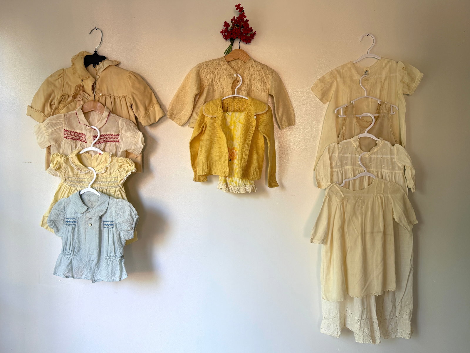 Antique Vintage 22 Piece Baby Clothing & Quilt Blanket Group: 22 piece collection of 1900s- 1940s baby clothing in a variety of styles. The group includes several white cotton and silk dresses and tops with delicate smocking and embroidery, along with colorful n