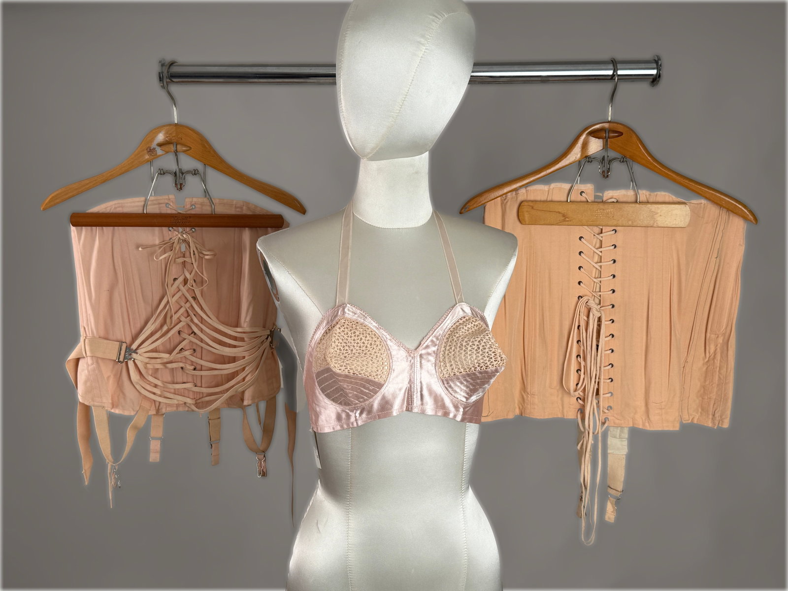 Vintage Lingerie (3) Laced Corset Girdles & Valencia Spain Bullet Bra: Vintage lingerie corset and bra group includes two pink cotton lace up corset girdles: one featuring a traditional metal grommet lacing system, and the second is a fan laced. Vintage bullet bra in a h