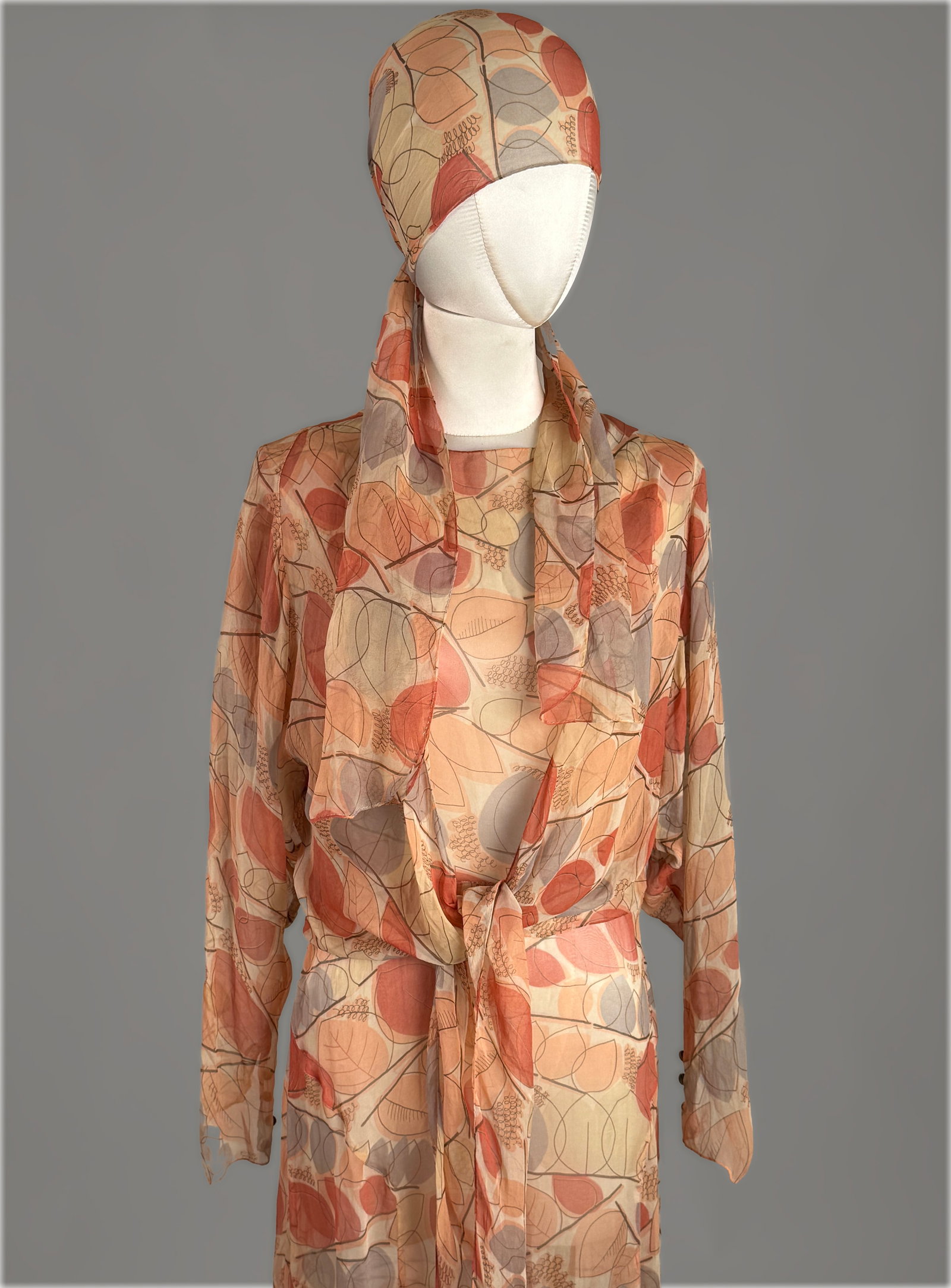 Vintage 1930s Silk Chiffon 3 Piece Dress Set Silk Chiffon Leaf Long Sleeve Jacket & Scarf: Vintage 1930s three piece dress set in a semi sheer silk chiffon fabric. The ensemble features a coordinated abstract graphic print composed of stylized leaf and seedpod motifs rendered in warm tones 