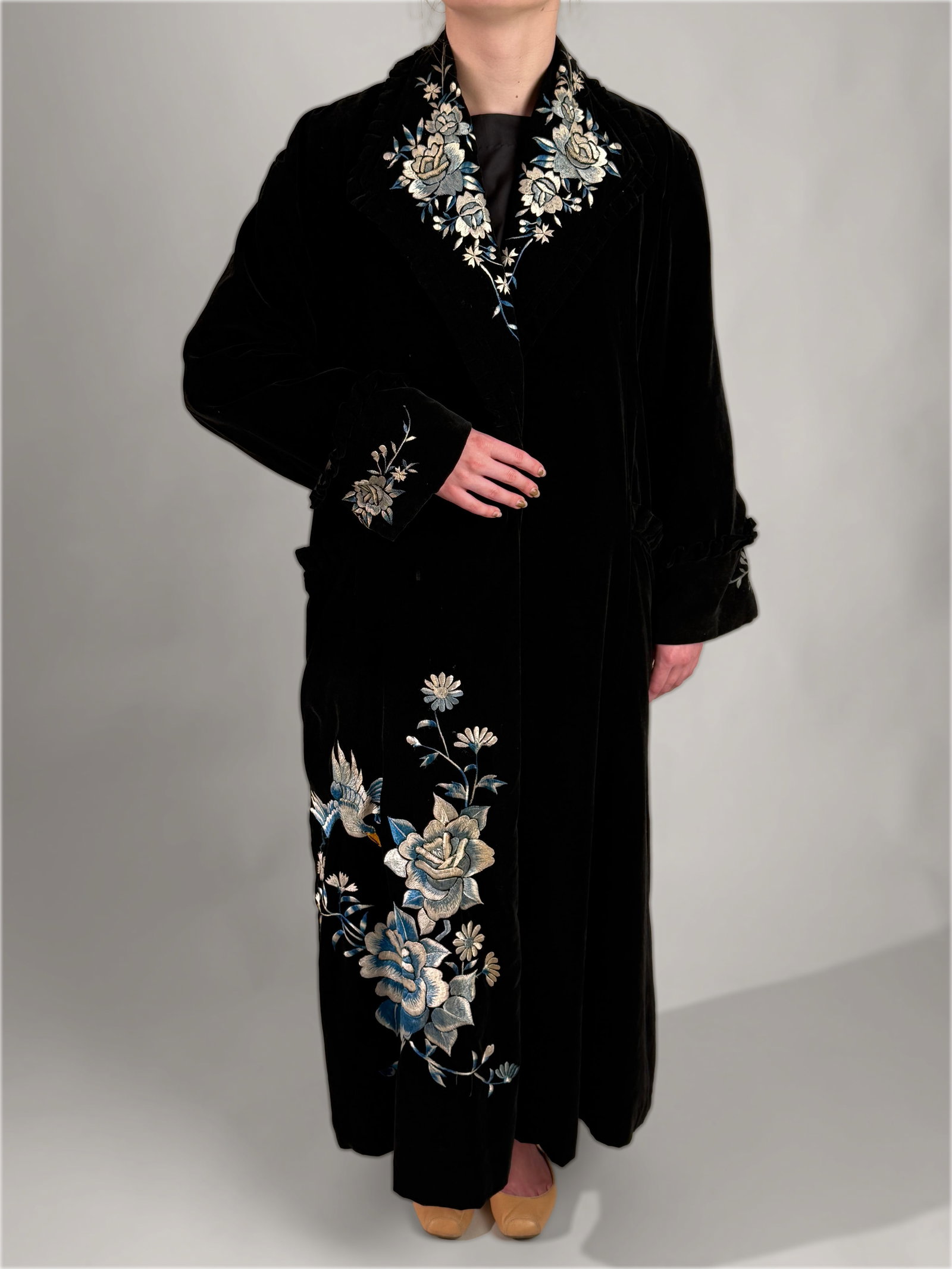Vintage 1940s 1950s Embroidered Opera Coat, Bird Flower Motif: Vintage 1940s to 1950s mid century coat or formal dressing gown crafted from a rich black velveteen fabric. It features intricate, large scale multi colored embroidery showcasing detailed ice blue, iv