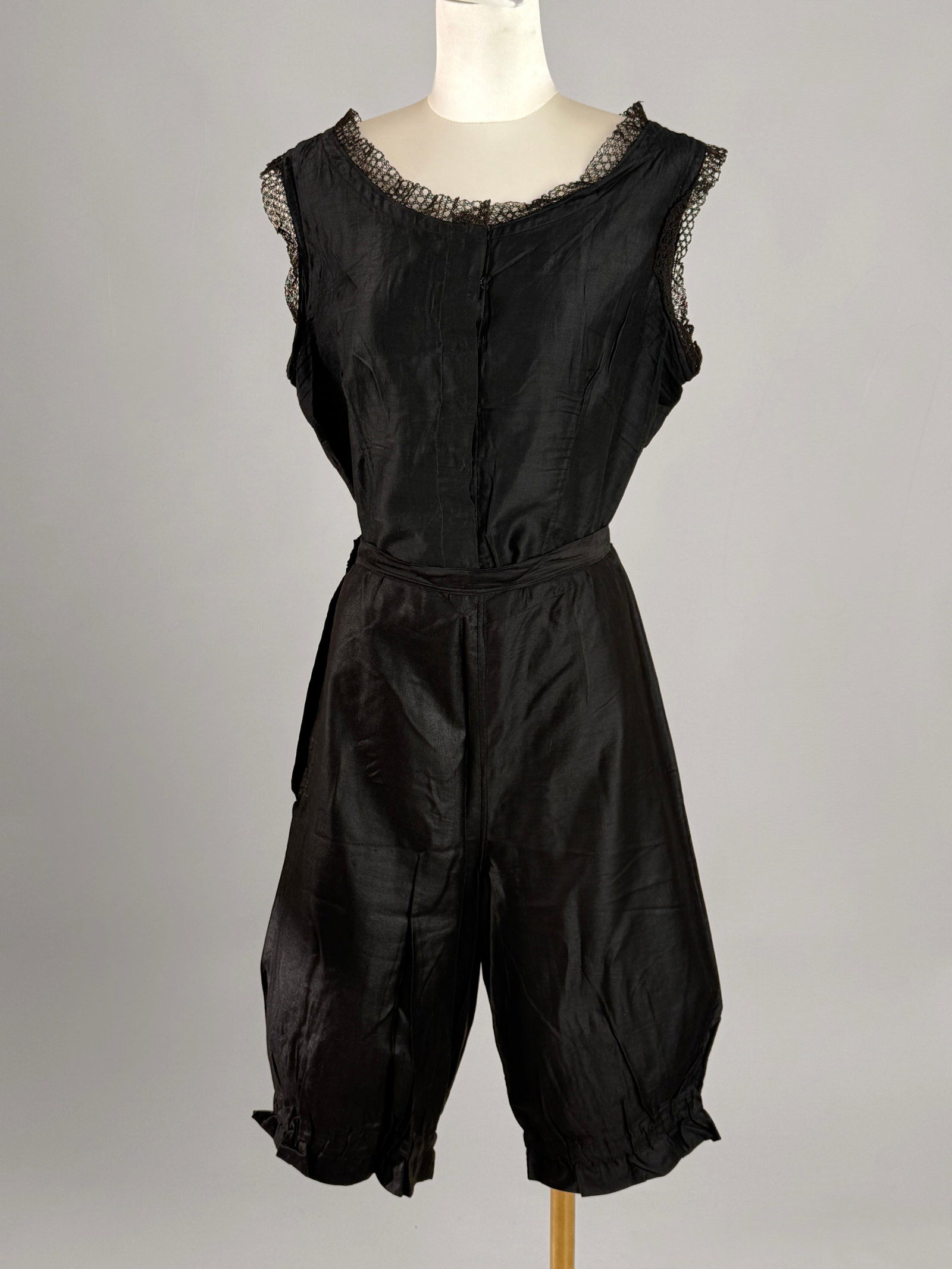 Antique Edwardian Black Silky Lingerie Bodice Chemise Bloomers Set: Antique 1900 Edwardian era undergarment set is crafted from a delicate, lightweight black silky cotton blend fabric. The sleeveless top features an elegant scooping neckline and open armholes, both be