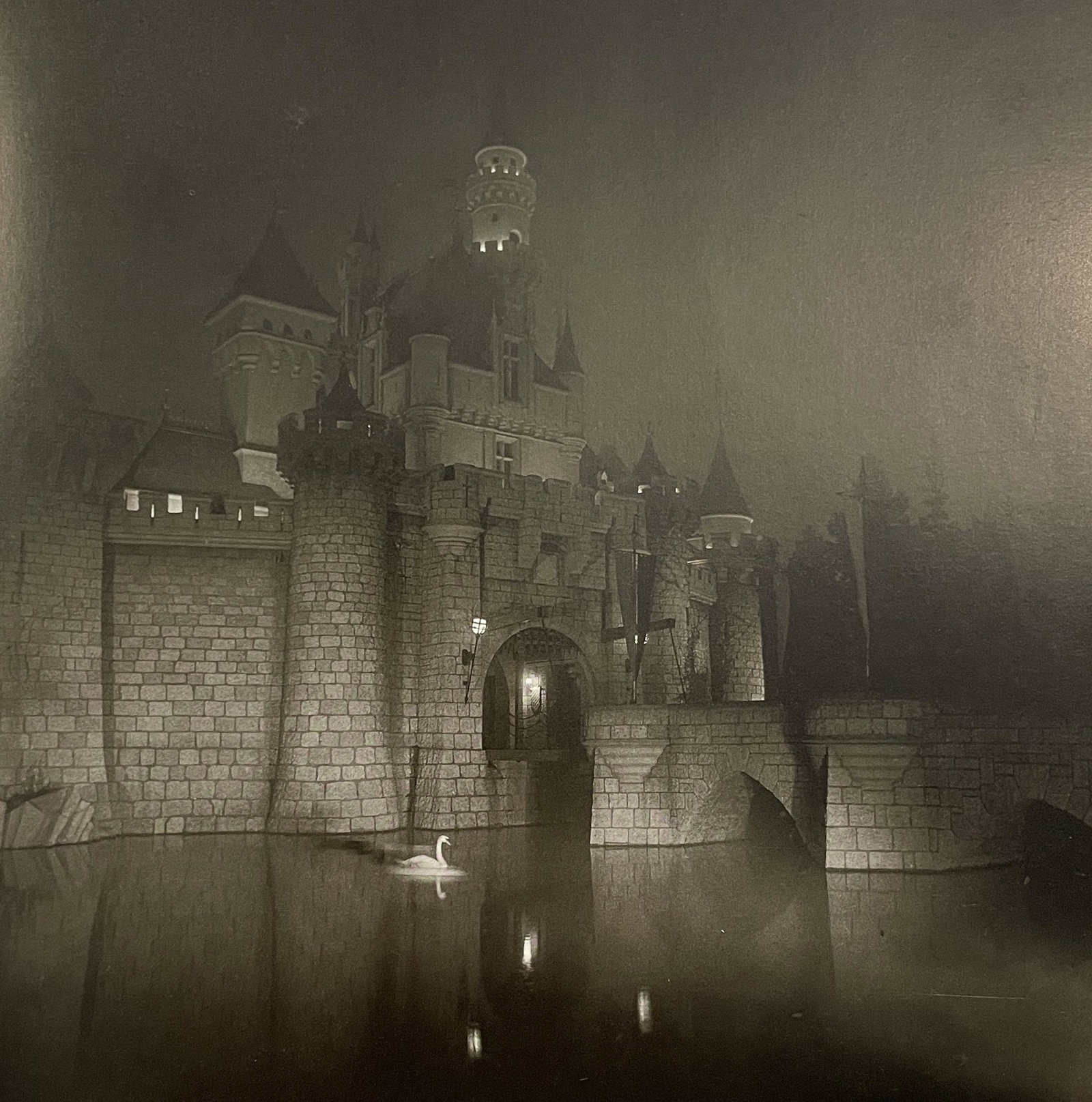 Diane Arbus - A Castle in Disneyland, 1962: DIANE ARBUS (1923-1971) A Castle in Disneyland, Cal, 1962 Print in Colors, Printed in the 1970s 8 1/4" x 8 1/4" Diane Arbus was an American photographer best known for her intimate black-and-white por